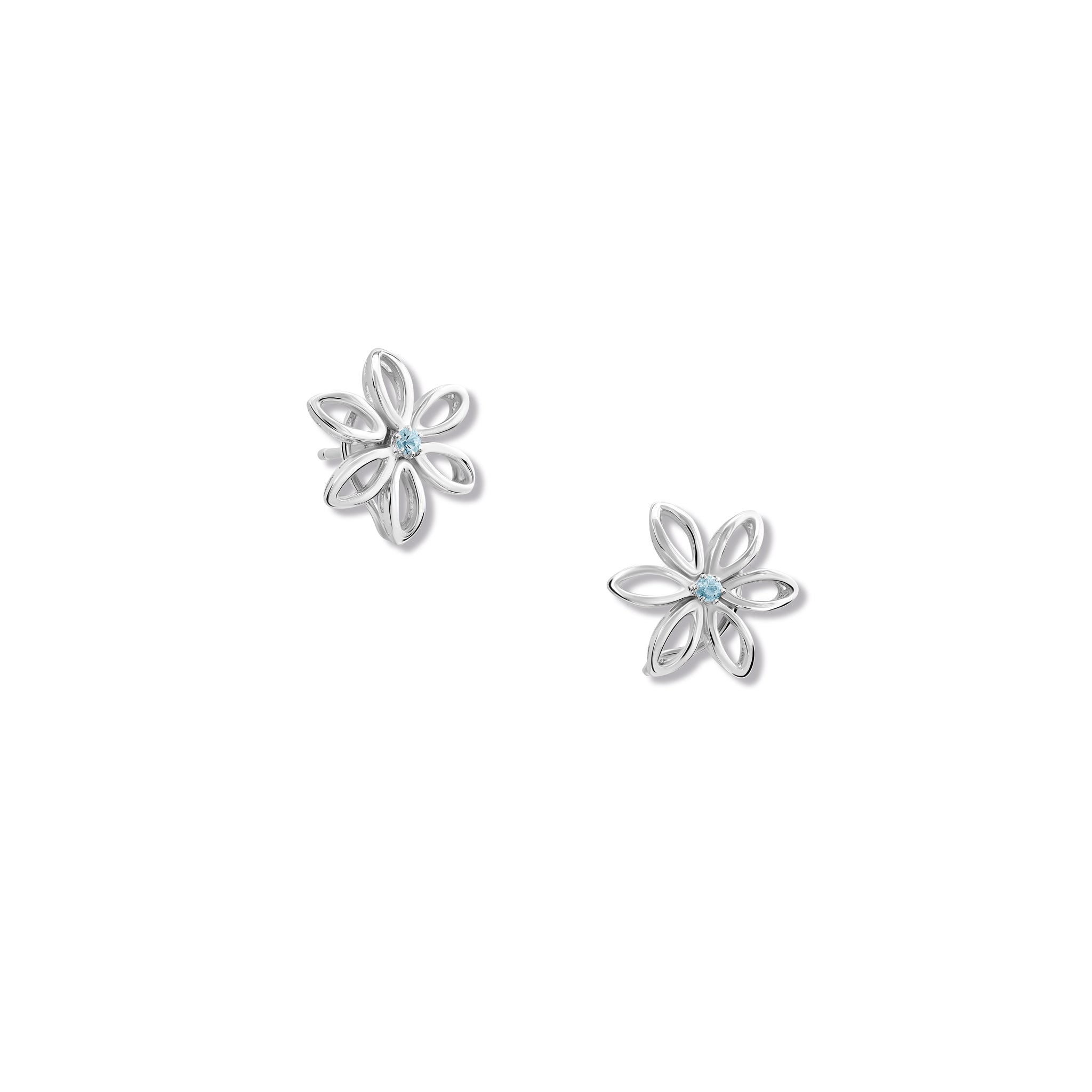 Handcrafted silver flower studs with a central blue topaz, birthstone of November.