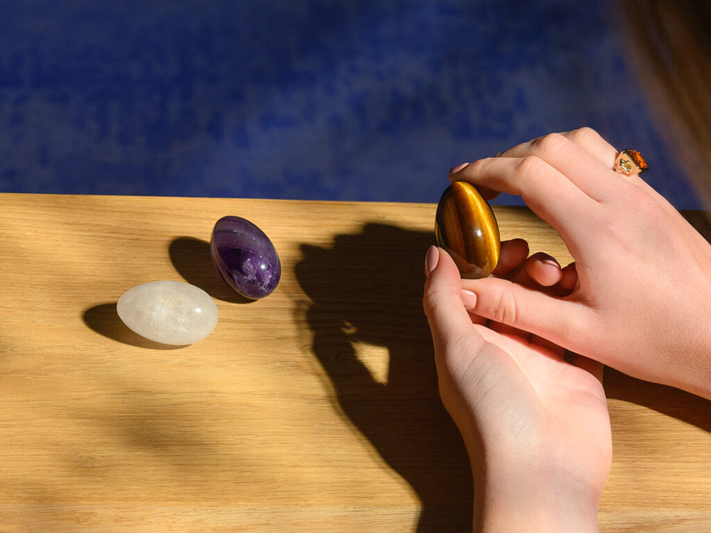 Studio shot of model holding gemstone eggs