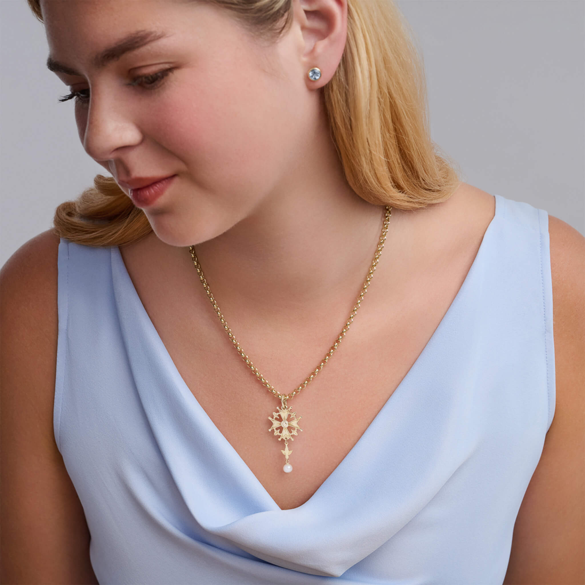 Handcrafted yellow gold Huguenot cross pendant with pearl, birthstone of June.