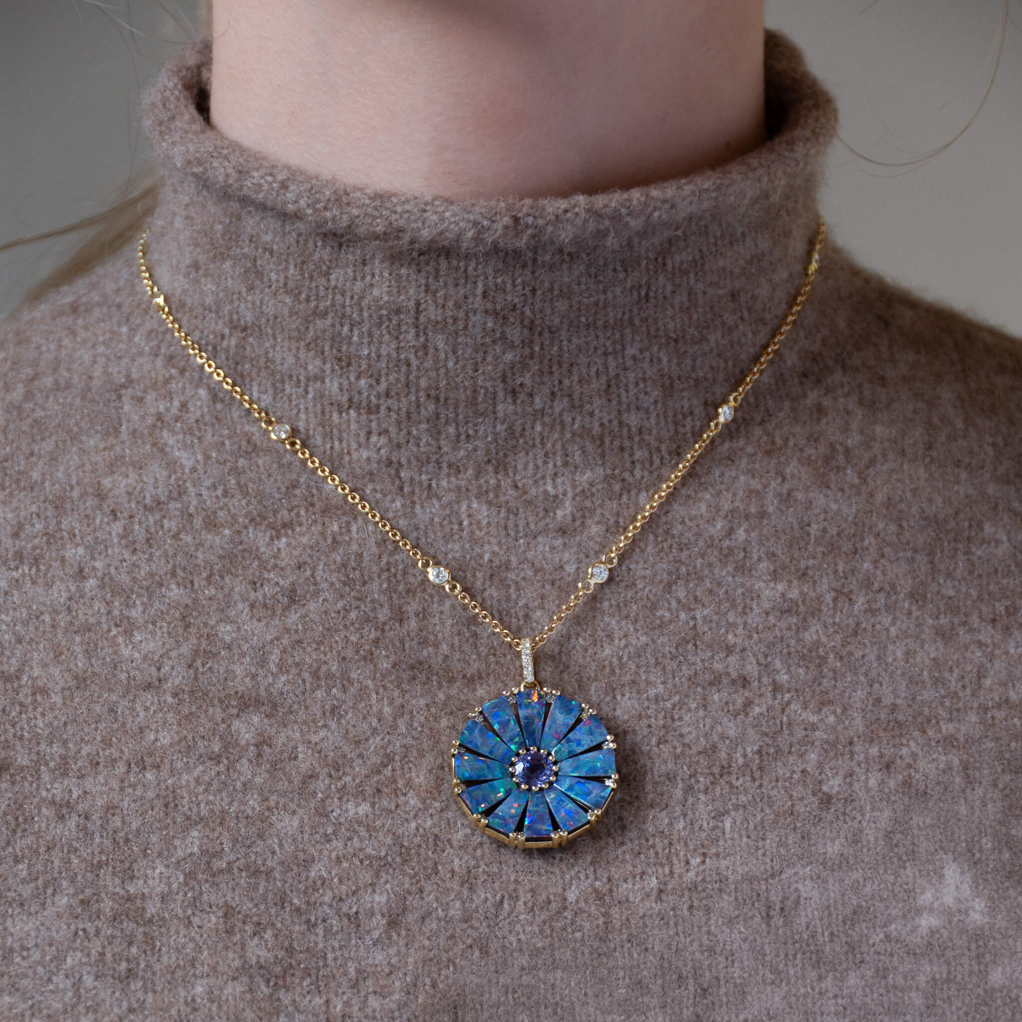 Handcrafted yellow gold circular necklace pendant with baguette cut blue boulder opal, diamond and tanzanite as centre stone, october & december birthstone