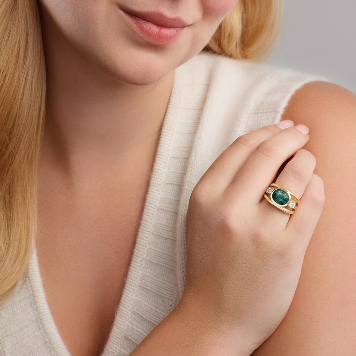 Model wears aeneus ring in 18ct yellow gold by Cassandra Goad, inspired by Aeneas of Troy