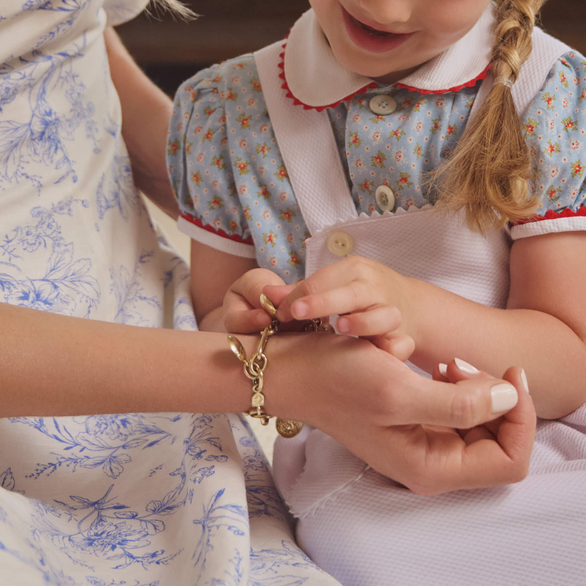 mother and child admiring cassandra goad jewels, mother's day gifts