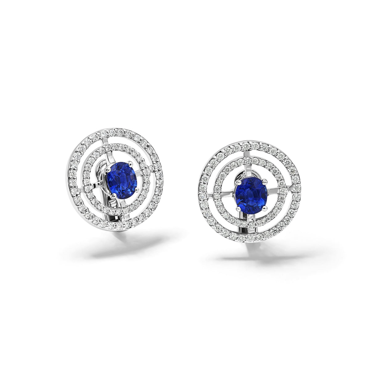 Handcrafted 18ct white gold stud earrings with claw set, cushions cut blue sapphire and a double row pave diamond