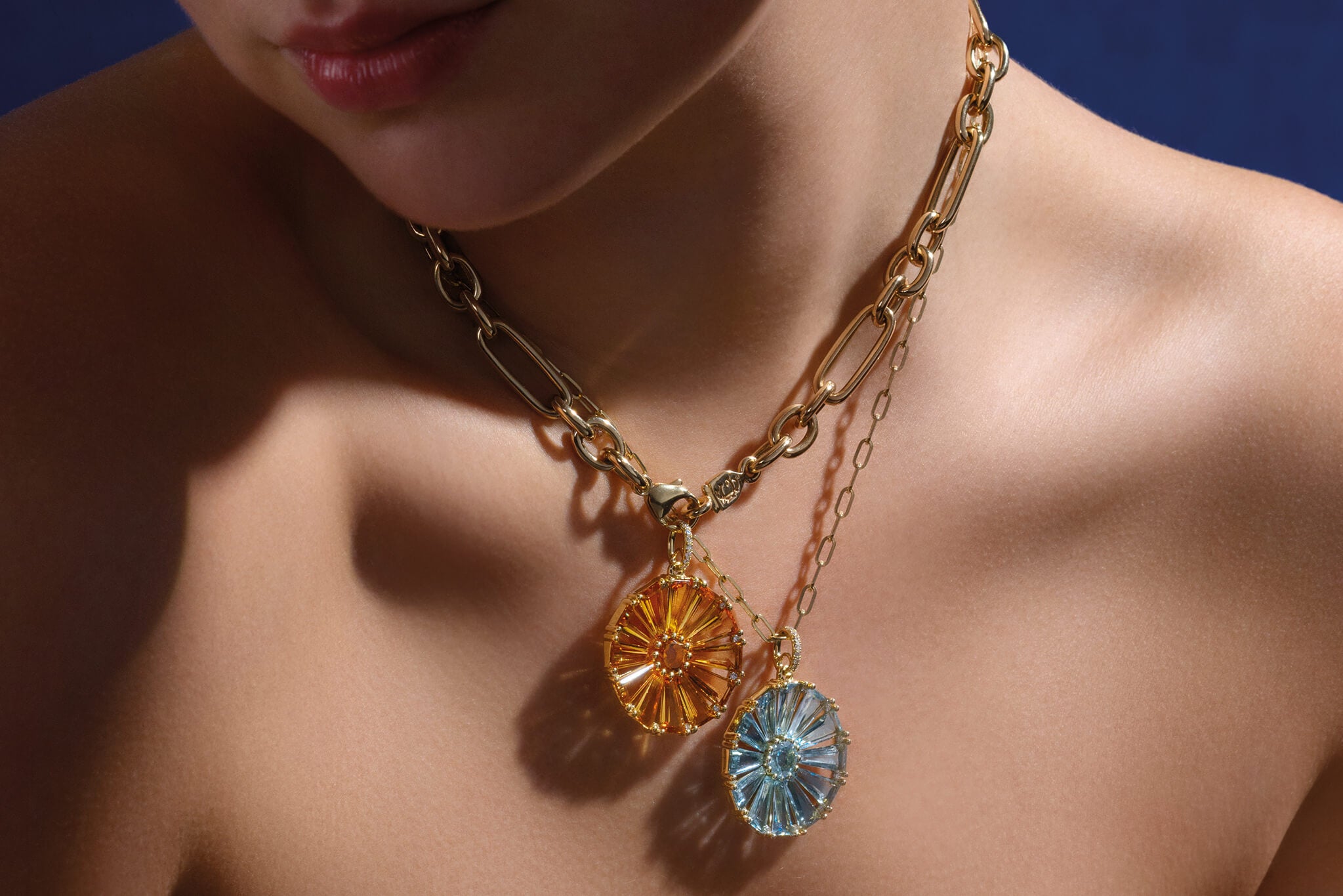 Model wearing Roi Soleil in citrine and blue topaz, the birthstones of November.
