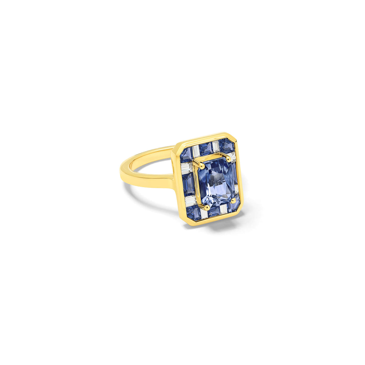 Handcrafted 18ct yellow gold ring featuring a central soft blue Ceylon sapphire surrounded by eight square cut sapphires and eight square cut diamonds.