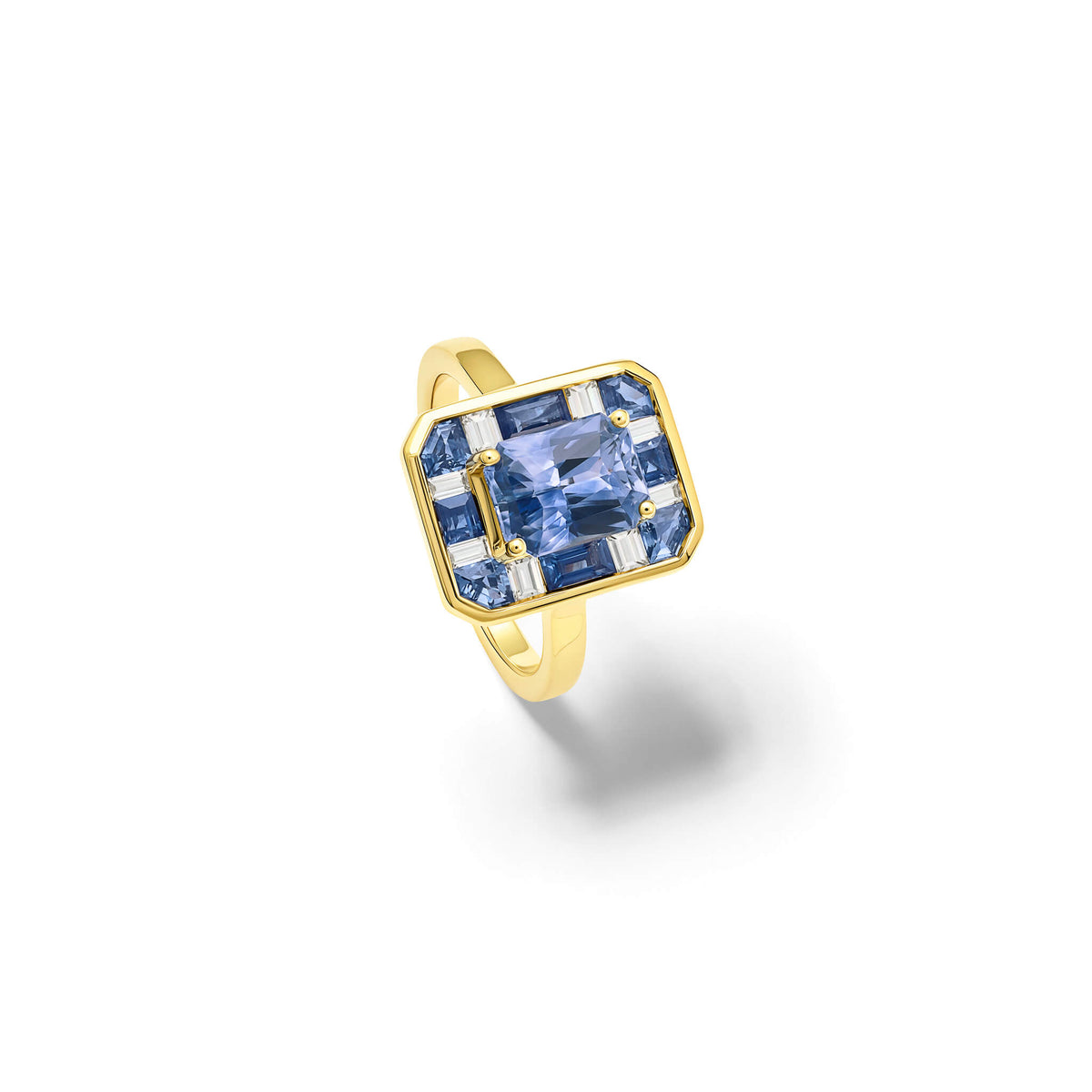Handcrafted 18ct yellow gold ring featuring a central soft blue Ceylon sapphire surrounded by eight square cut sapphires and eight square cut diamonds.