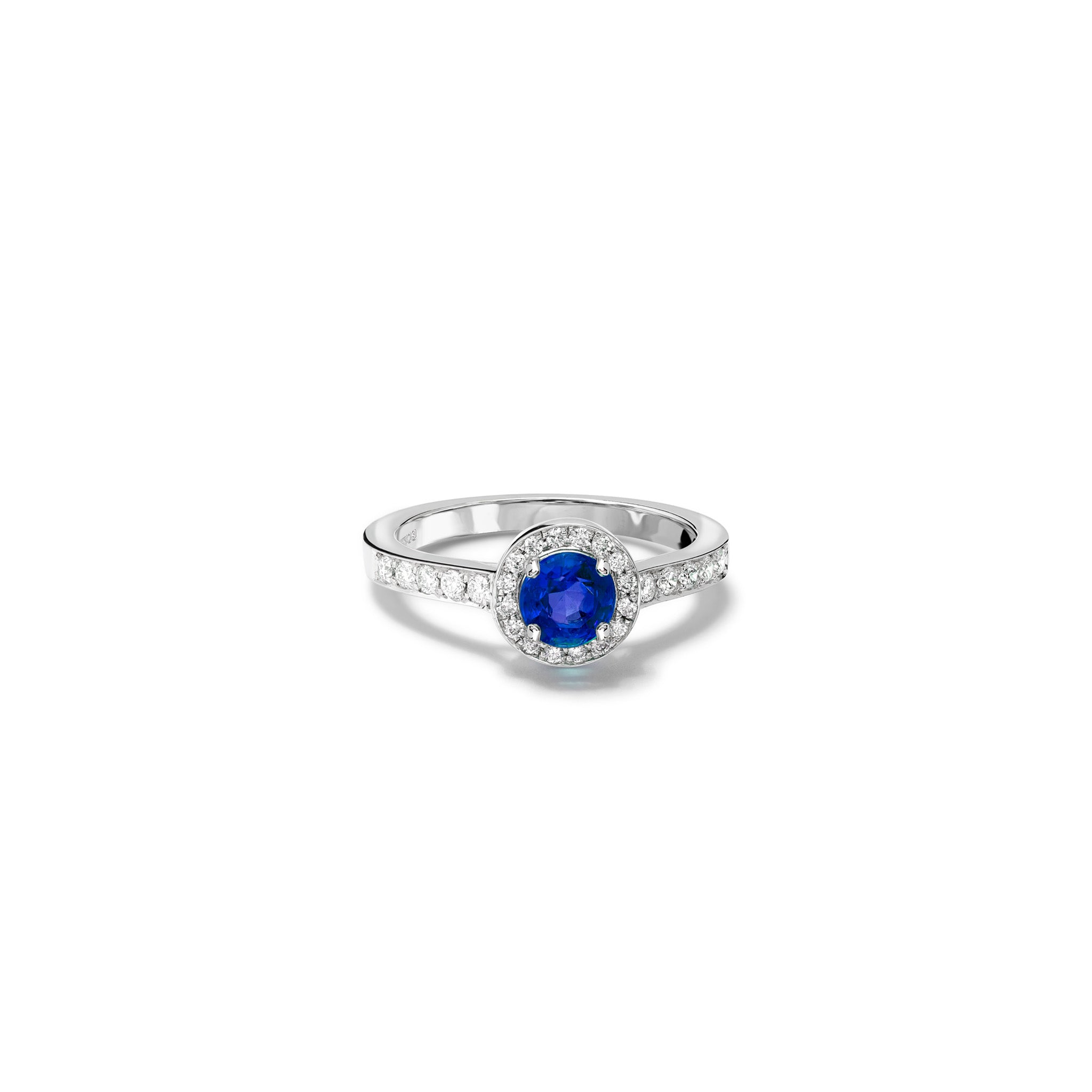 Handcrafted 18ct white gold engagement ring with a round cut sapphire at the centre, surrounded by smaller diamonds and diamond pave, september birthstone