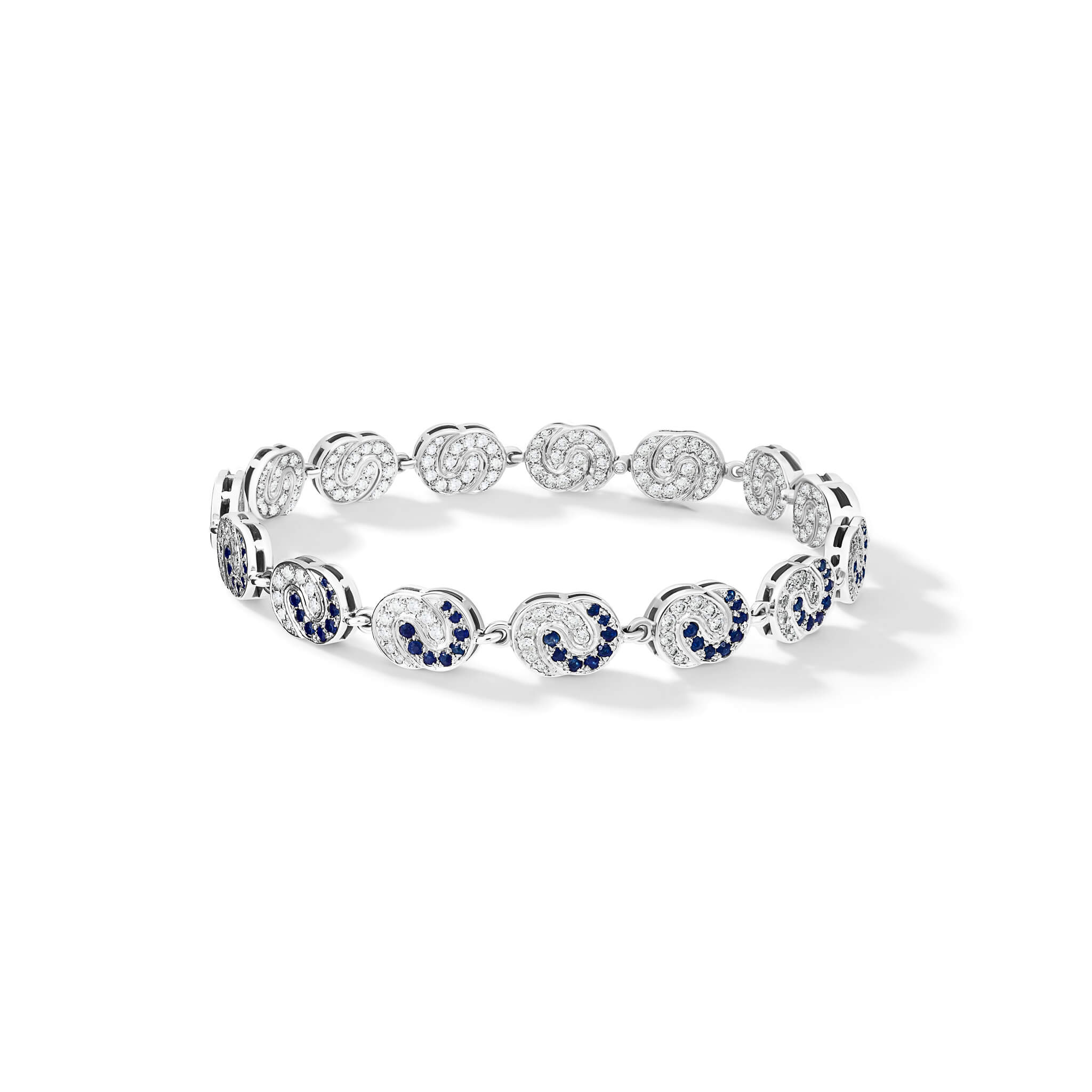 Handcrafted 18ct white gold Sabina bracelet with diamonds on one side and diamonds and blue sapphire on the other, can be worn as a necklace attaching two bracelets with a section.