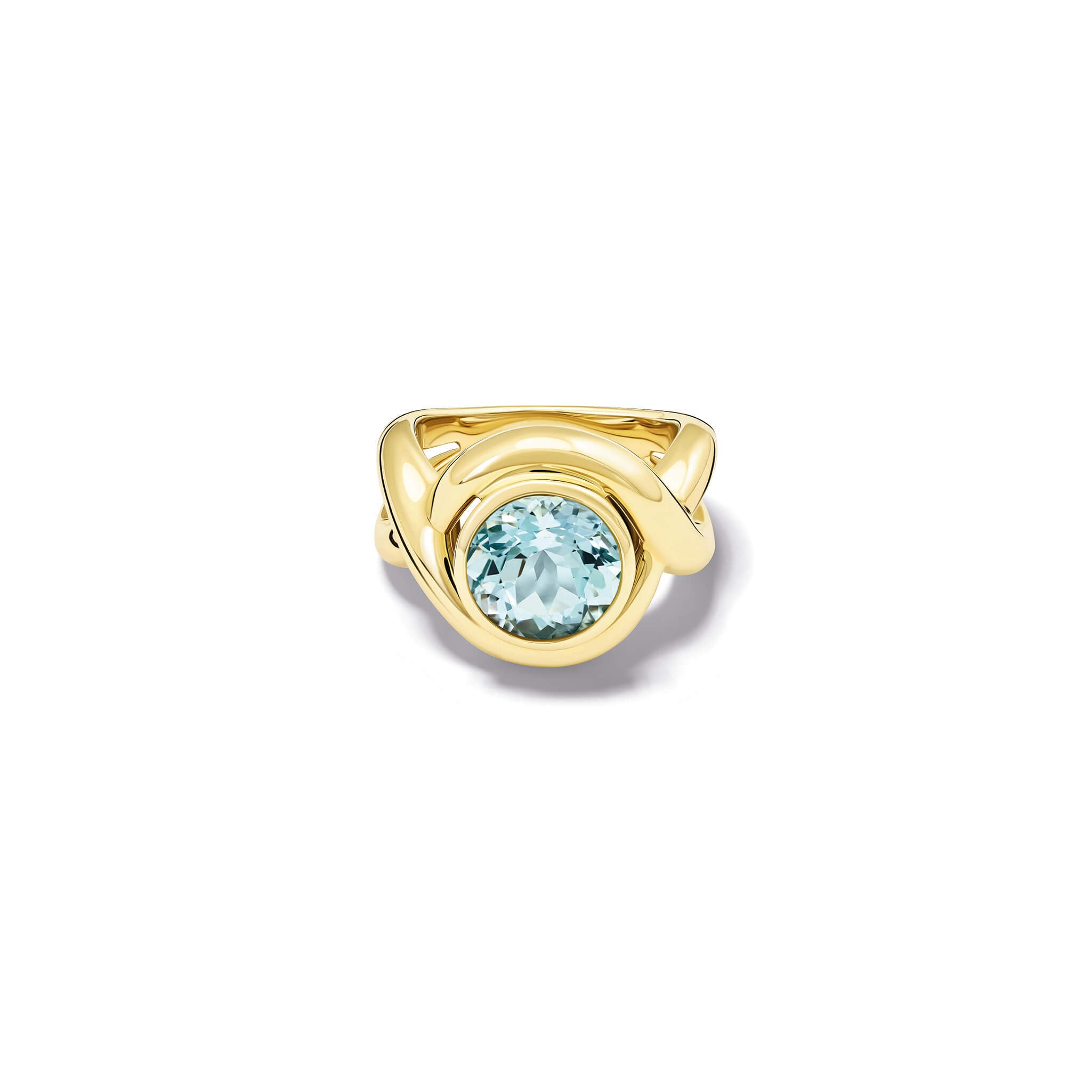 Handcrafted yellow gold ring featuring curved shanks with a round blue topaz, birthstone of November.