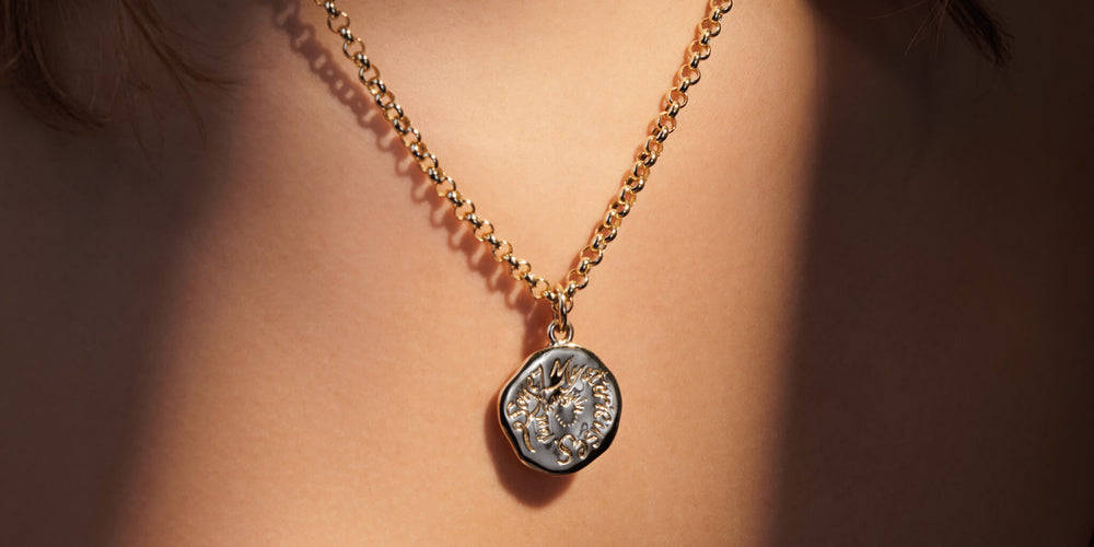 model wearing silver quote pendant