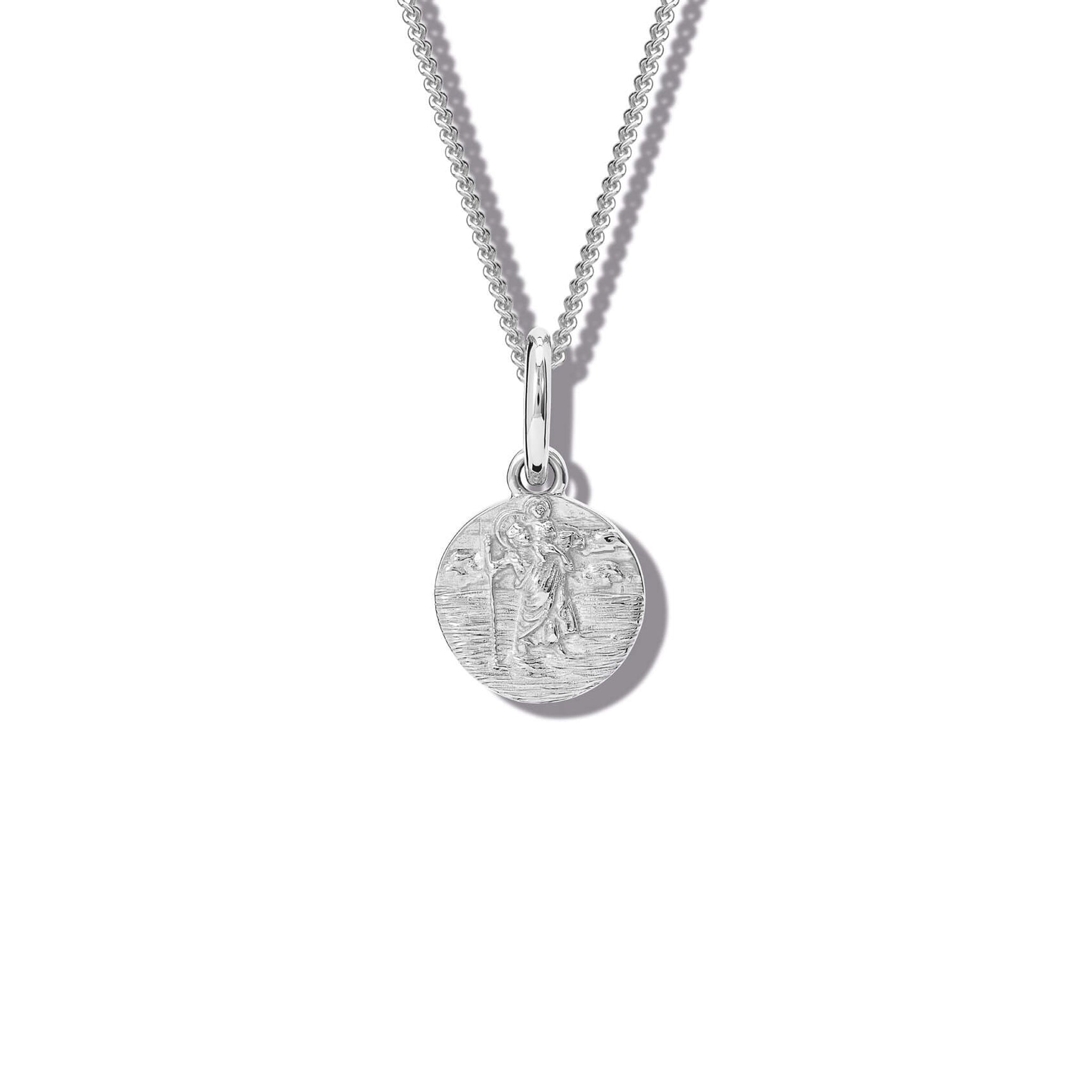 Handcrafted round sterling silver necklace pendant featuring an engraving of Saint Christopher, hanging from a silver chain.