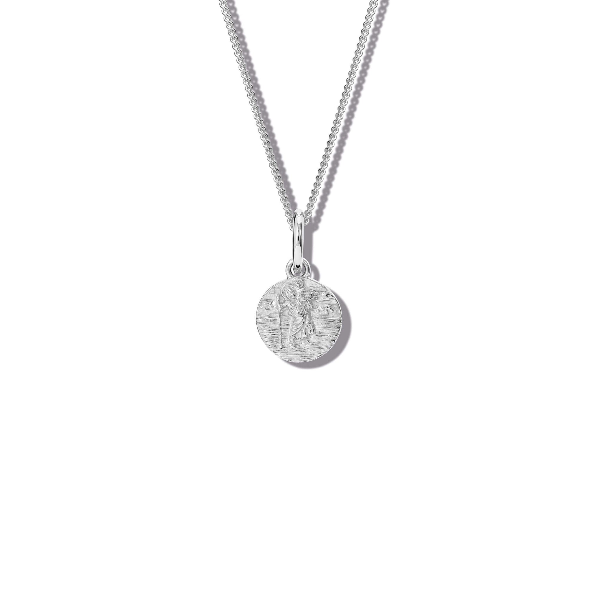 Handcrafted round silver necklace pendant featuring an engraving of Saint Christopher, hanging from a silver chain