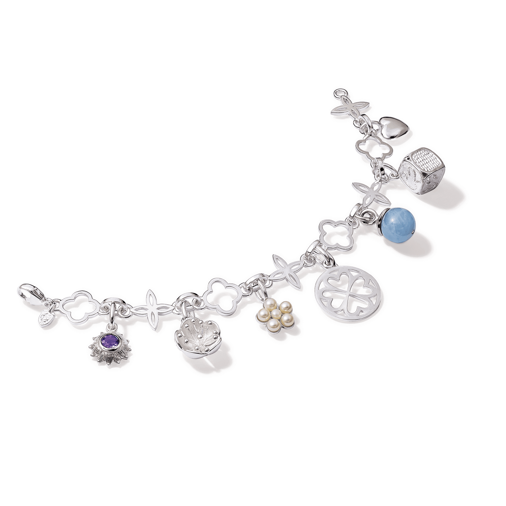 Handcrafted bespoke silver bracelet with charms attached.