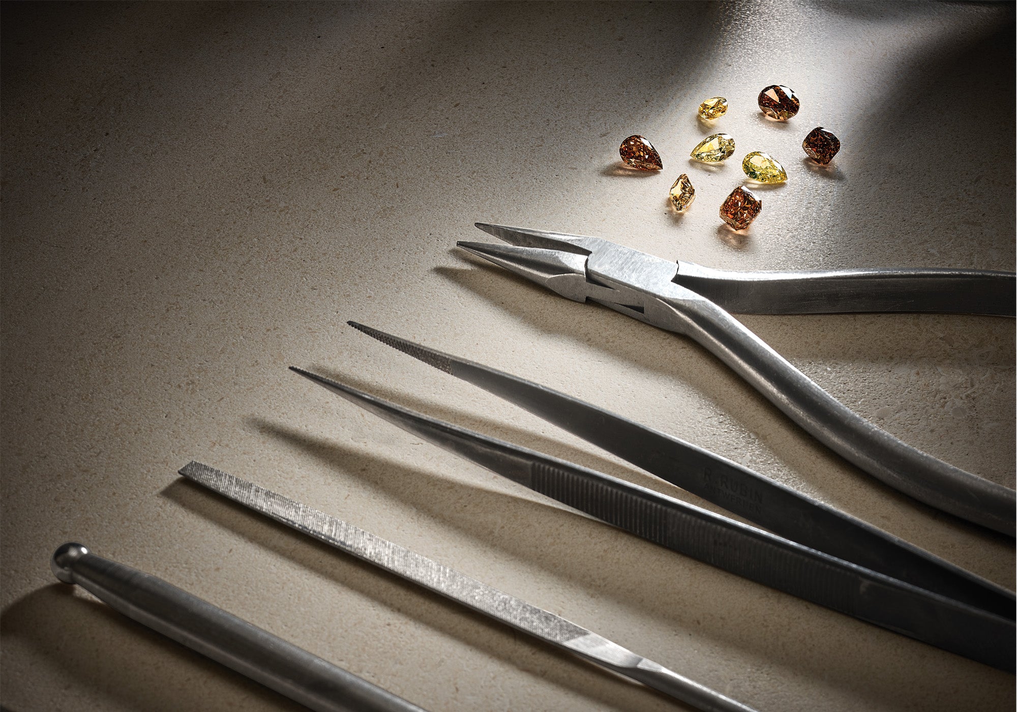 Workshop tools with brown precious gemstones.