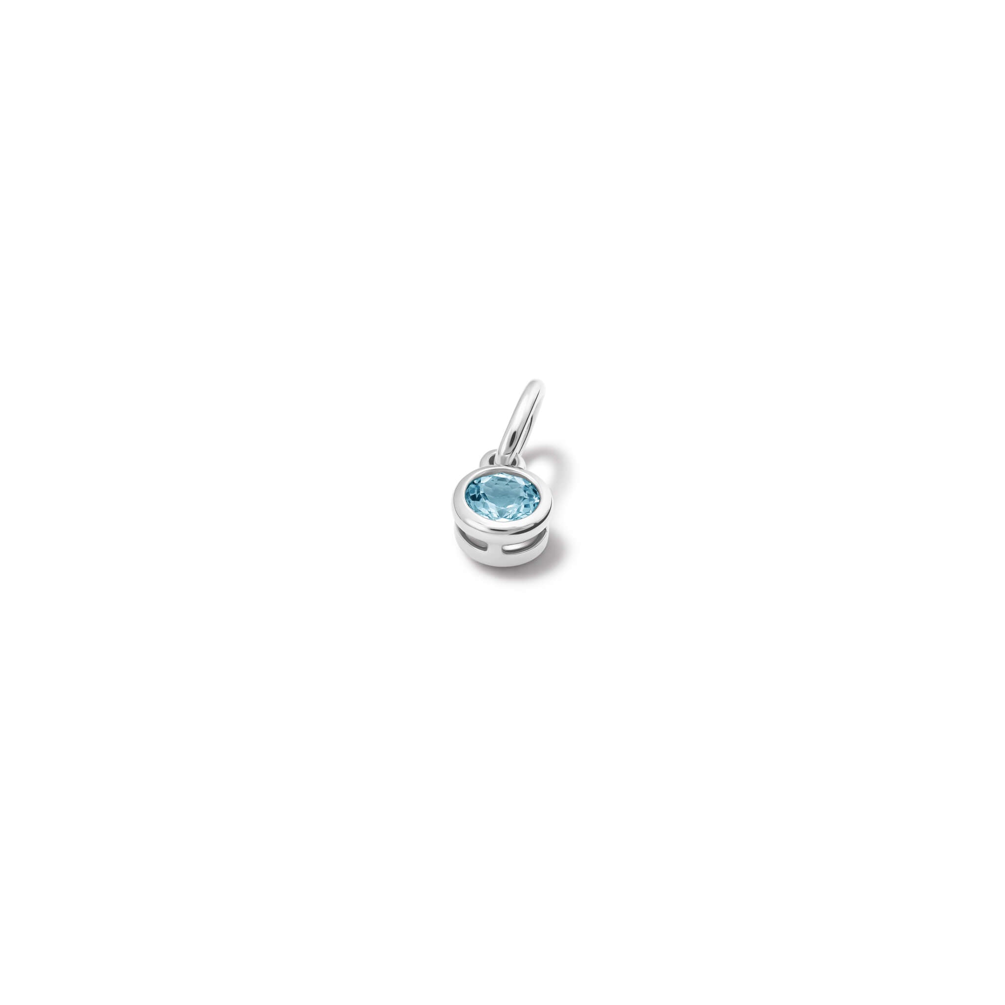 Handcrafted necklace pendant in silver featuring facetted blue topaz, the birthstone of November