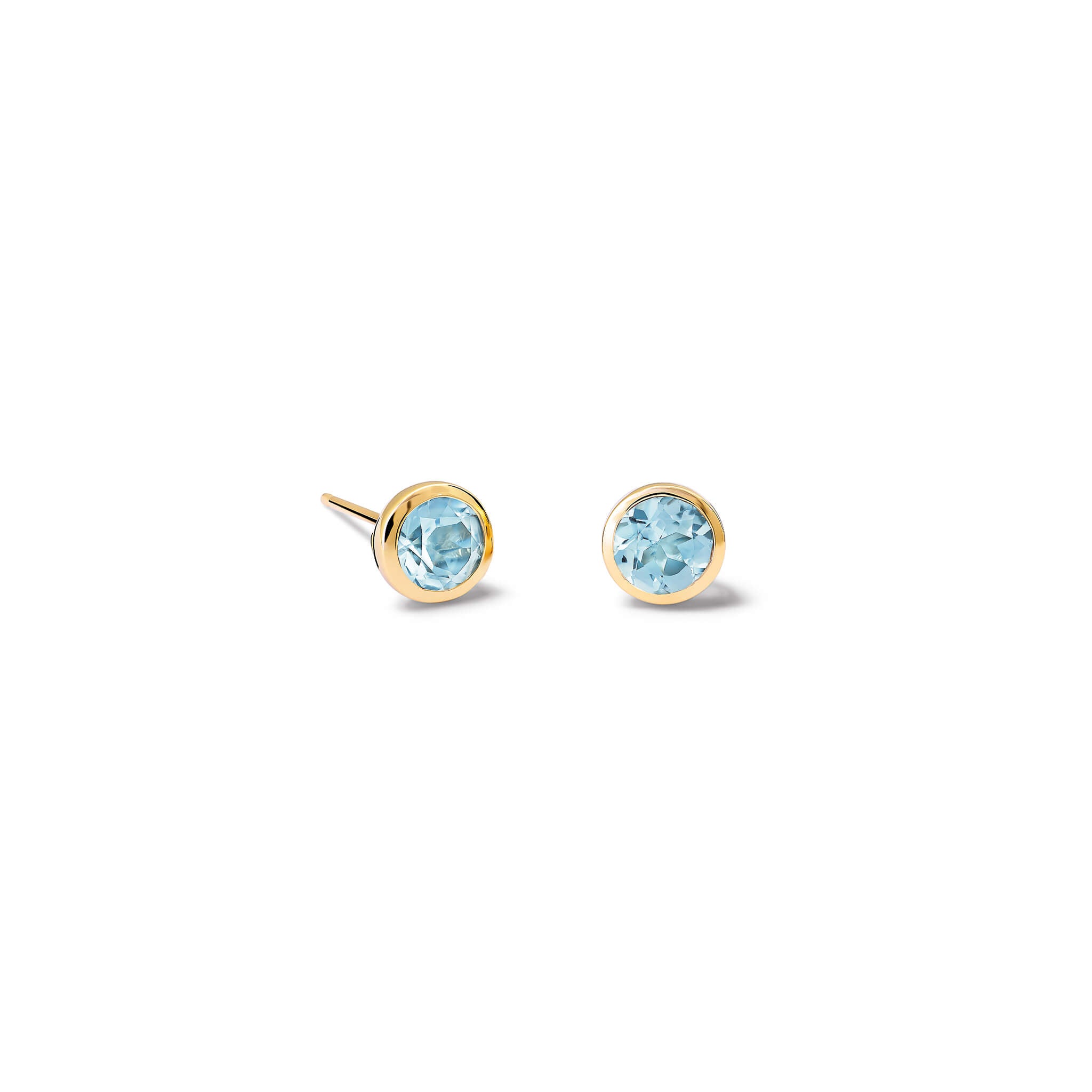 Handcrafted 9ct yellow gold stud earrings featuring round blue topaz, birthstone of November.