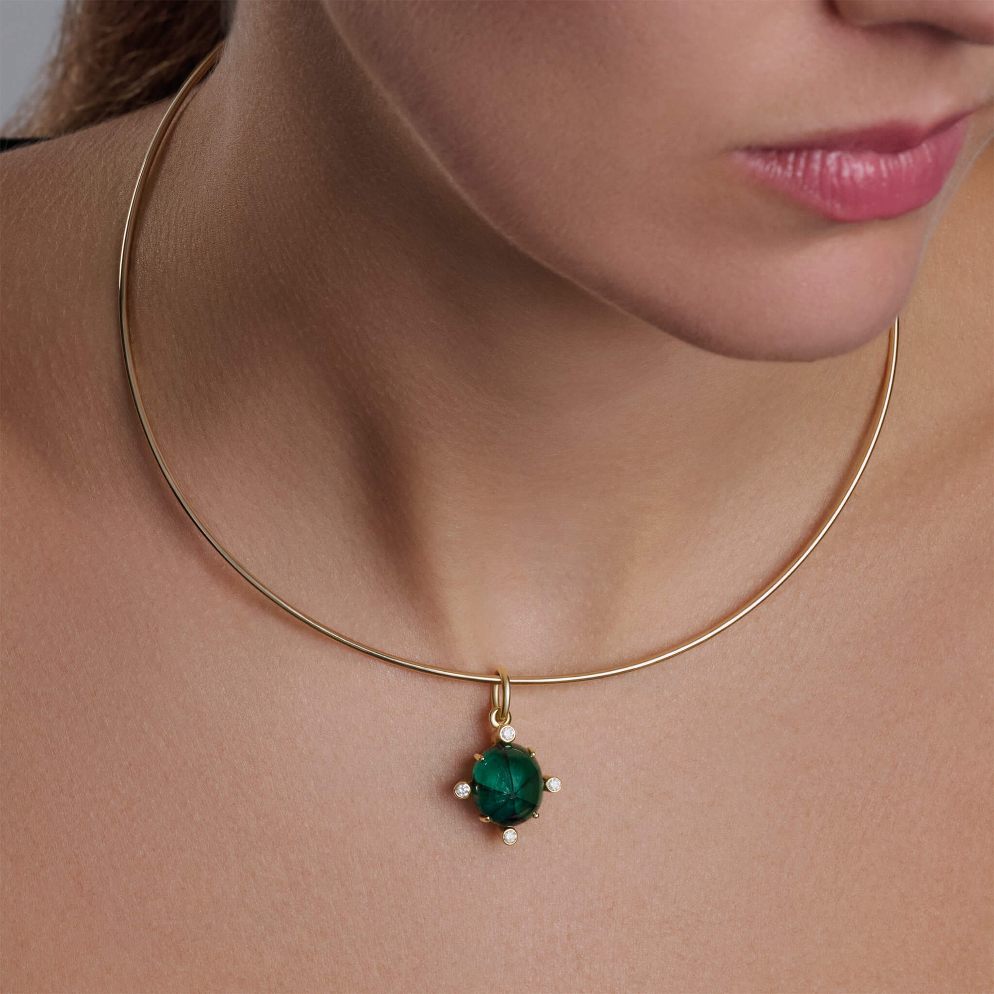 Model wearing Compass pendant with trapiche emerald and diamond on Calypso torque necklace.