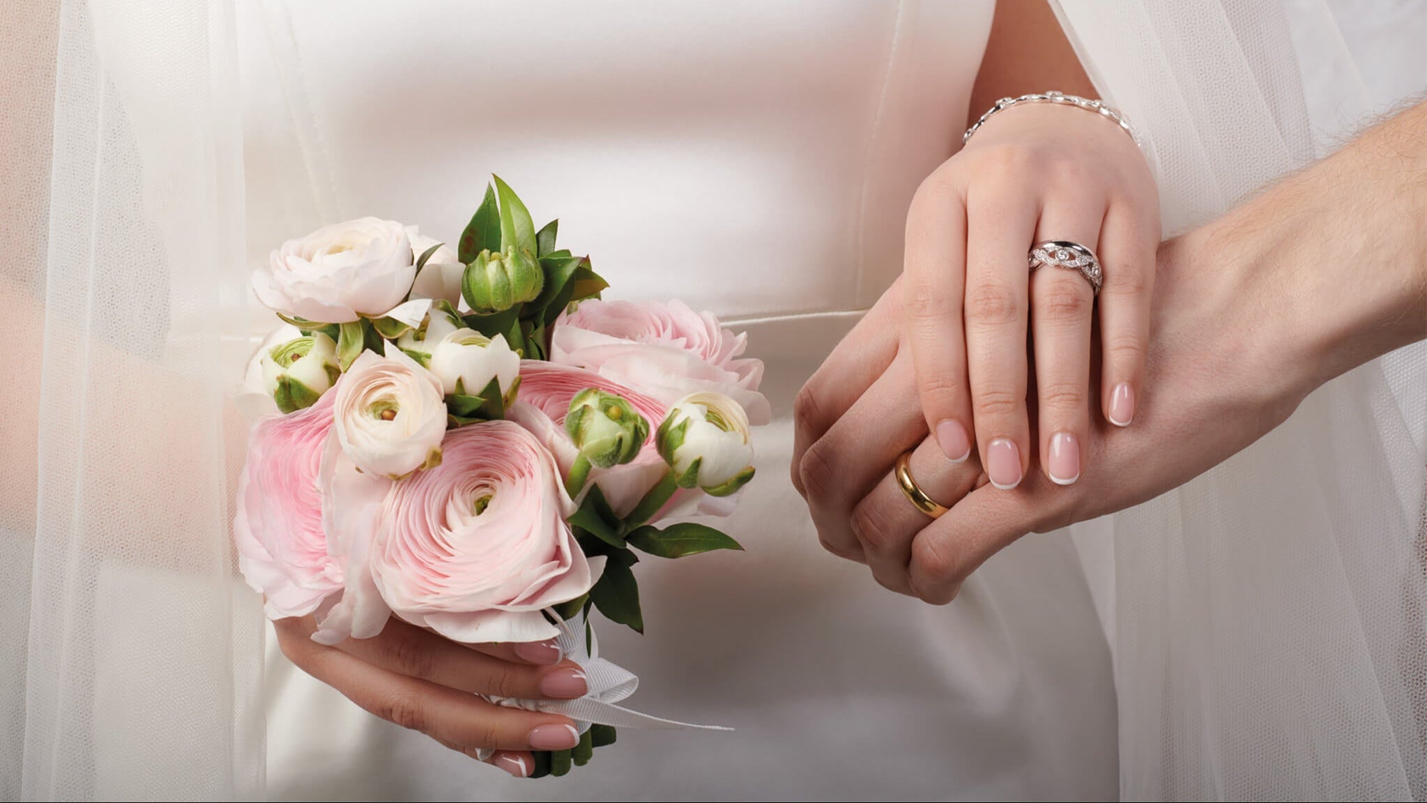models wearing handcrafted yellow gold and white gold wedding bands, bridal jewellery, engagement ring