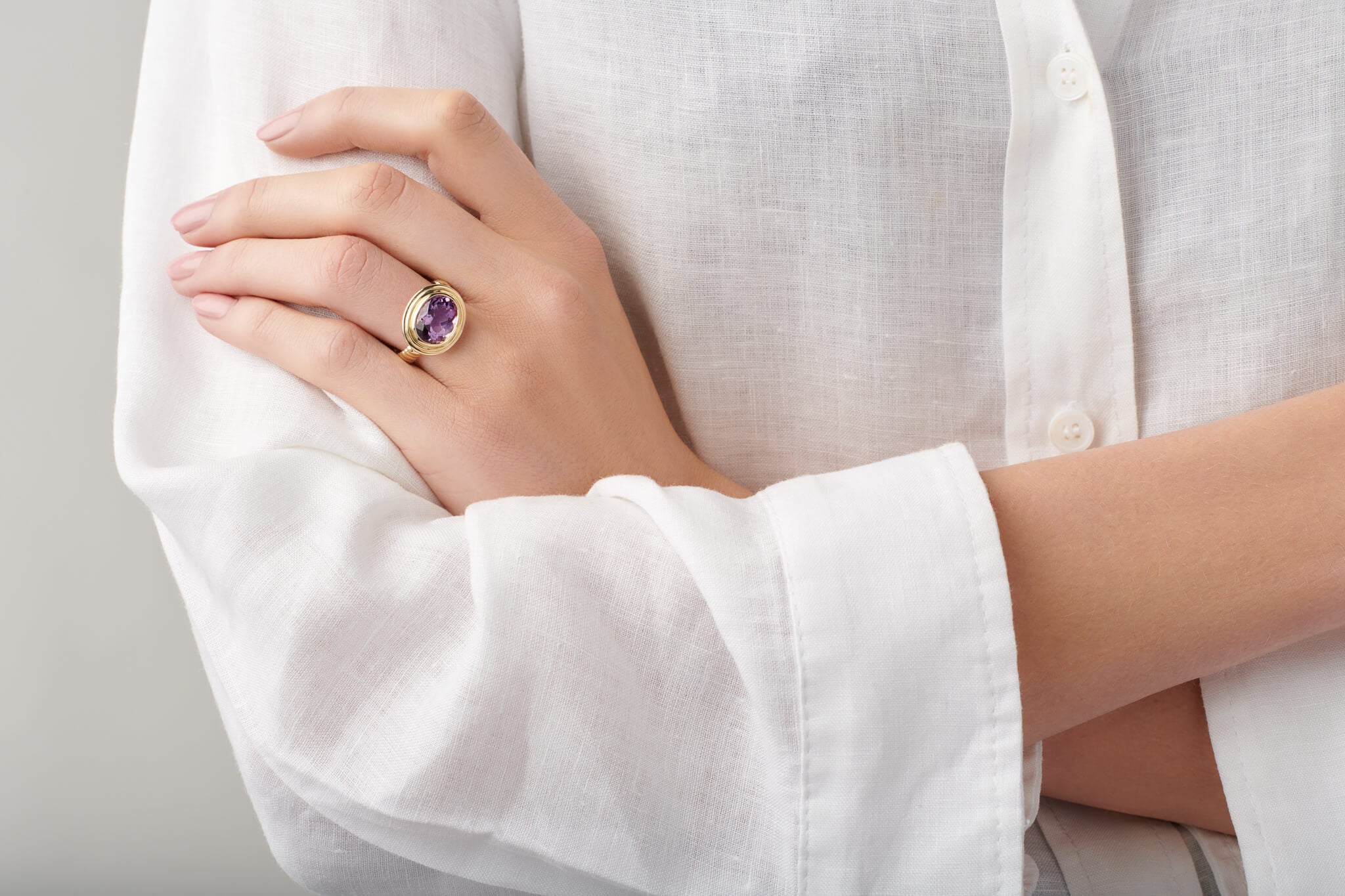 Model wearing amethyst Whirpool II ring.