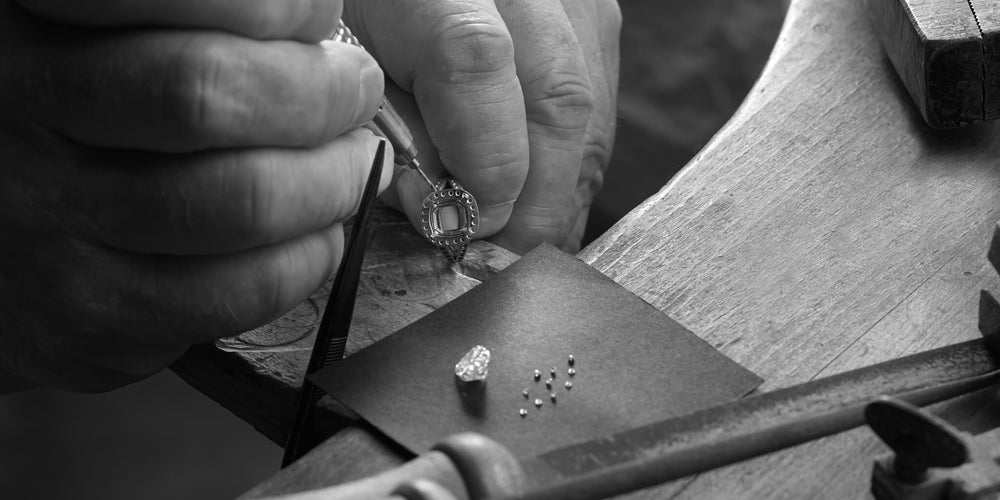 Man creating bespoke engagement ring in workshop