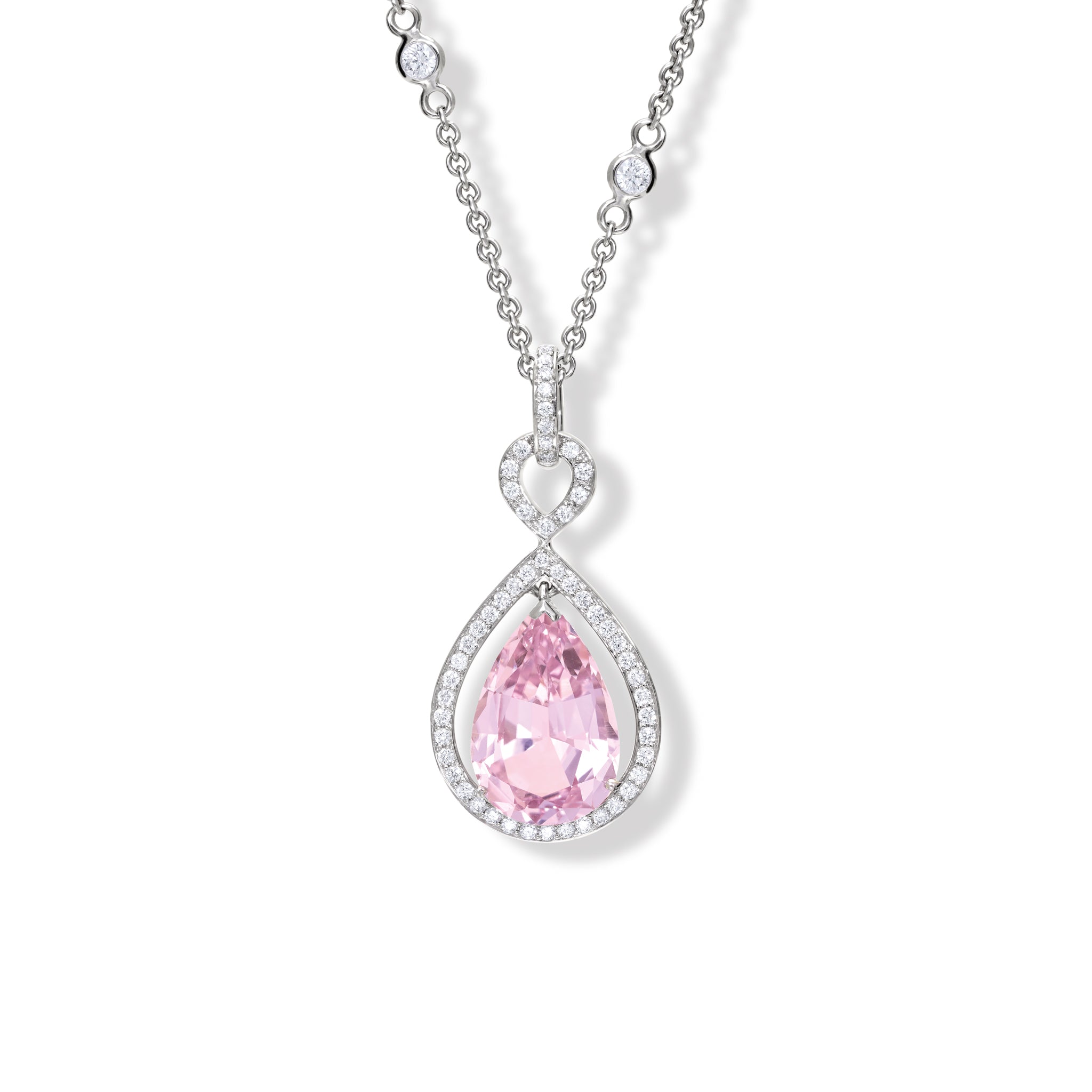 Handcrafted 18ct white gold necklace pendant featuring a central morganite surrounded by diamonds.