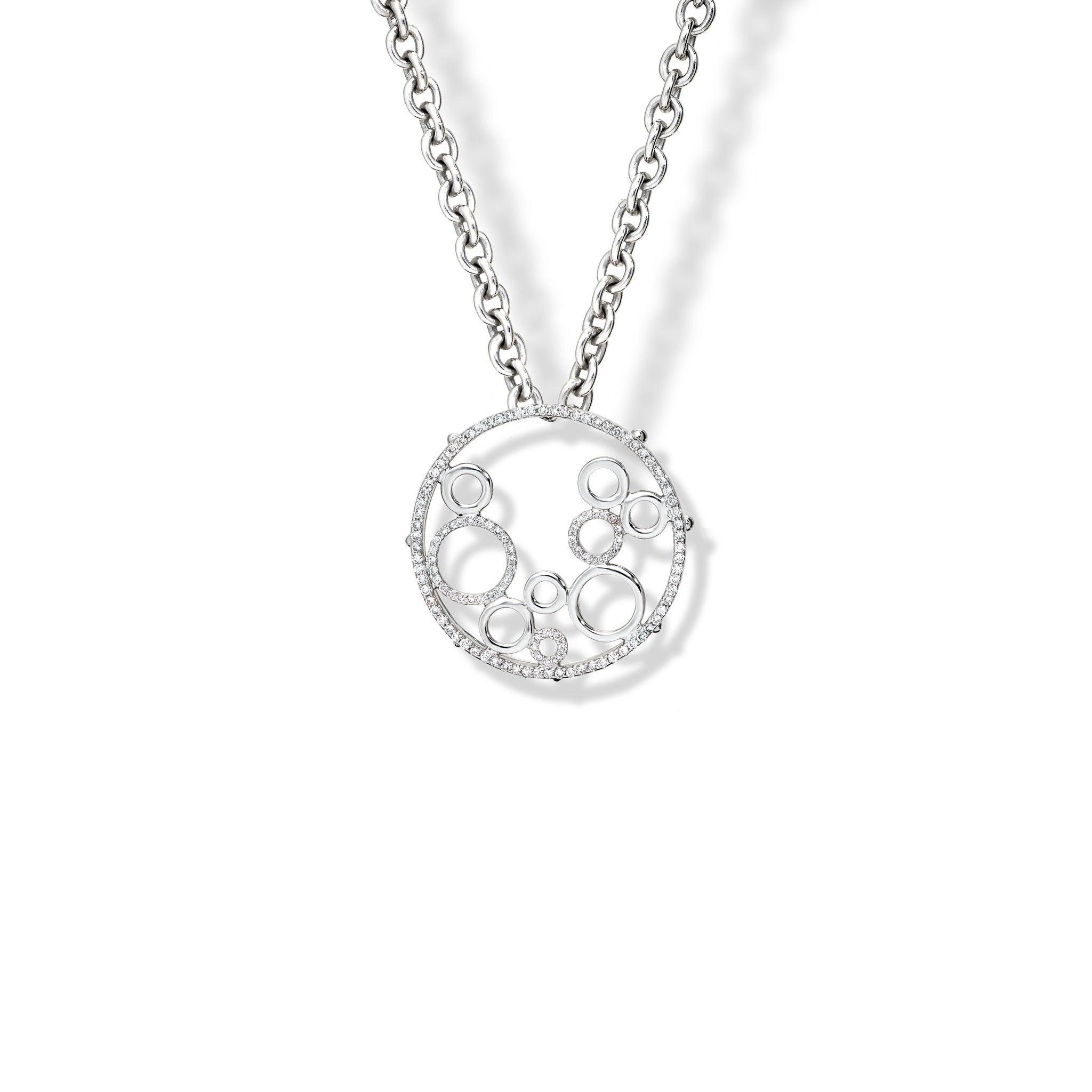 Handcrafted 18ct white gold necklace pendant featuring an open circular design with variously sized cut-out circles with diamonds.