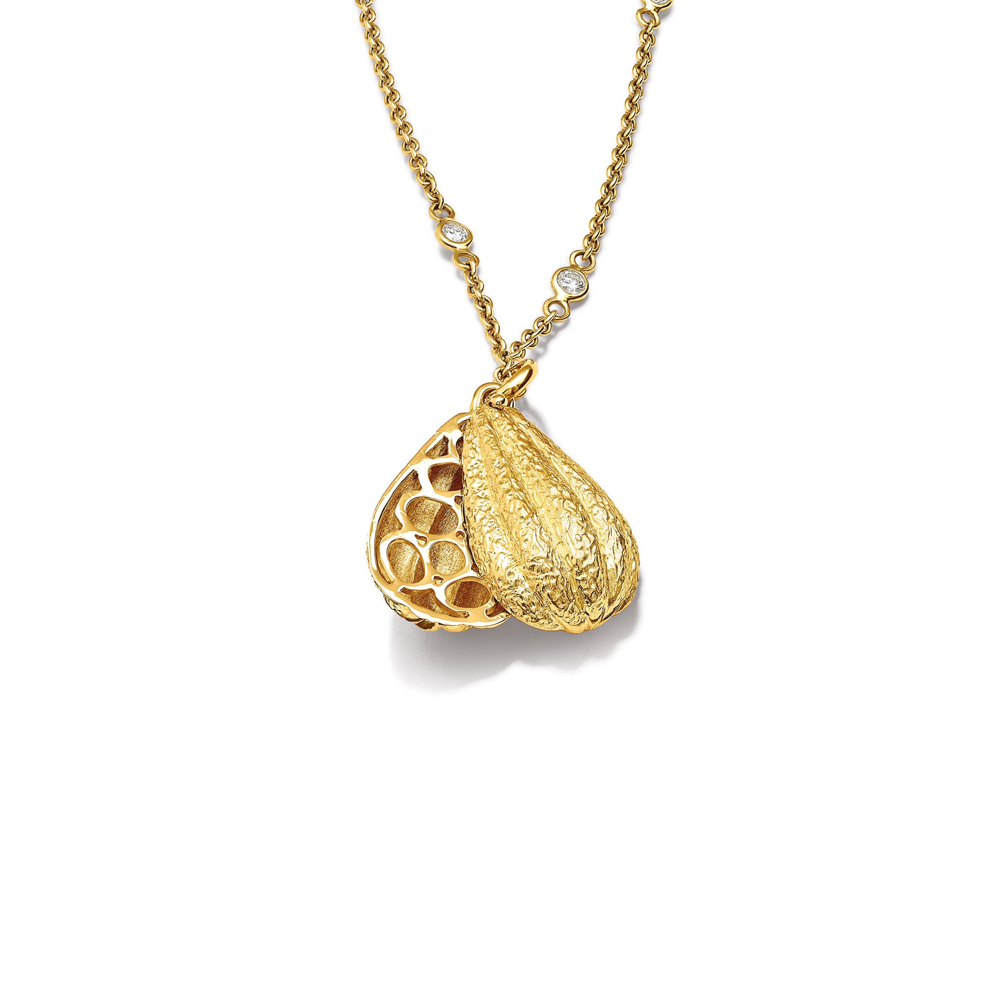 Handcrafted 9ct yellow gold necklace pendant in the shape of a cocoa pod which swivels open. For chocolate lovers.