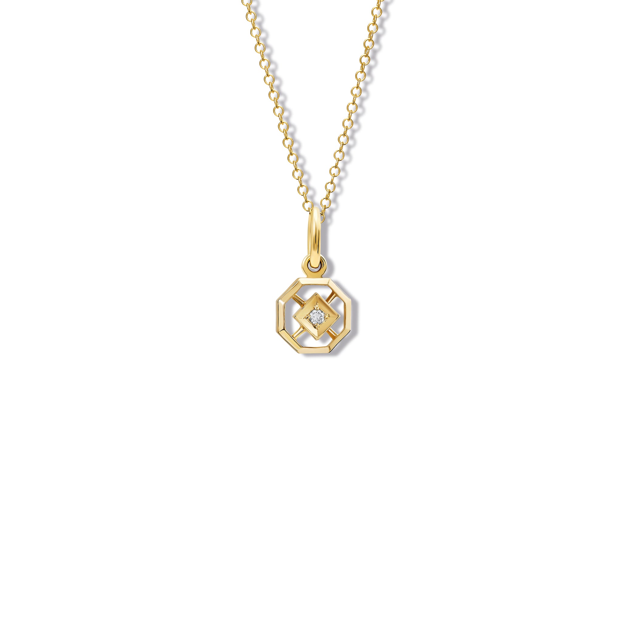 Handcrafted yellow gold necklace pendant featuring an octagonal design with a central diamond, birthstone of April.