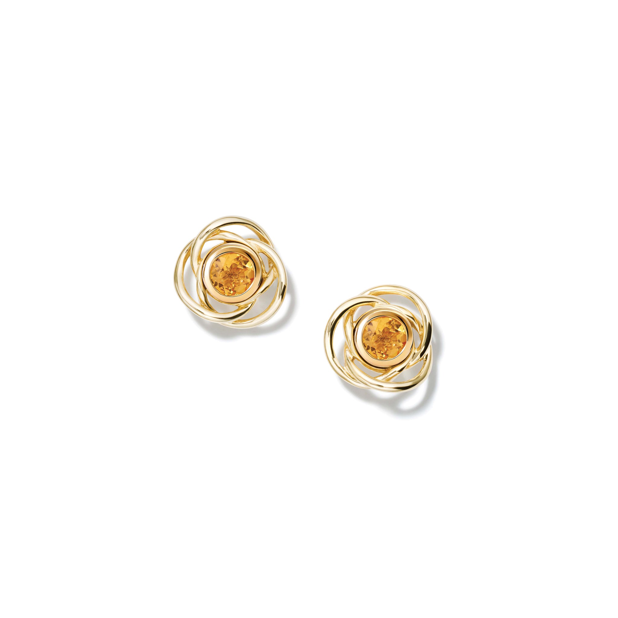 Handcrafted yellow gold earring halos featuring three layered circles.