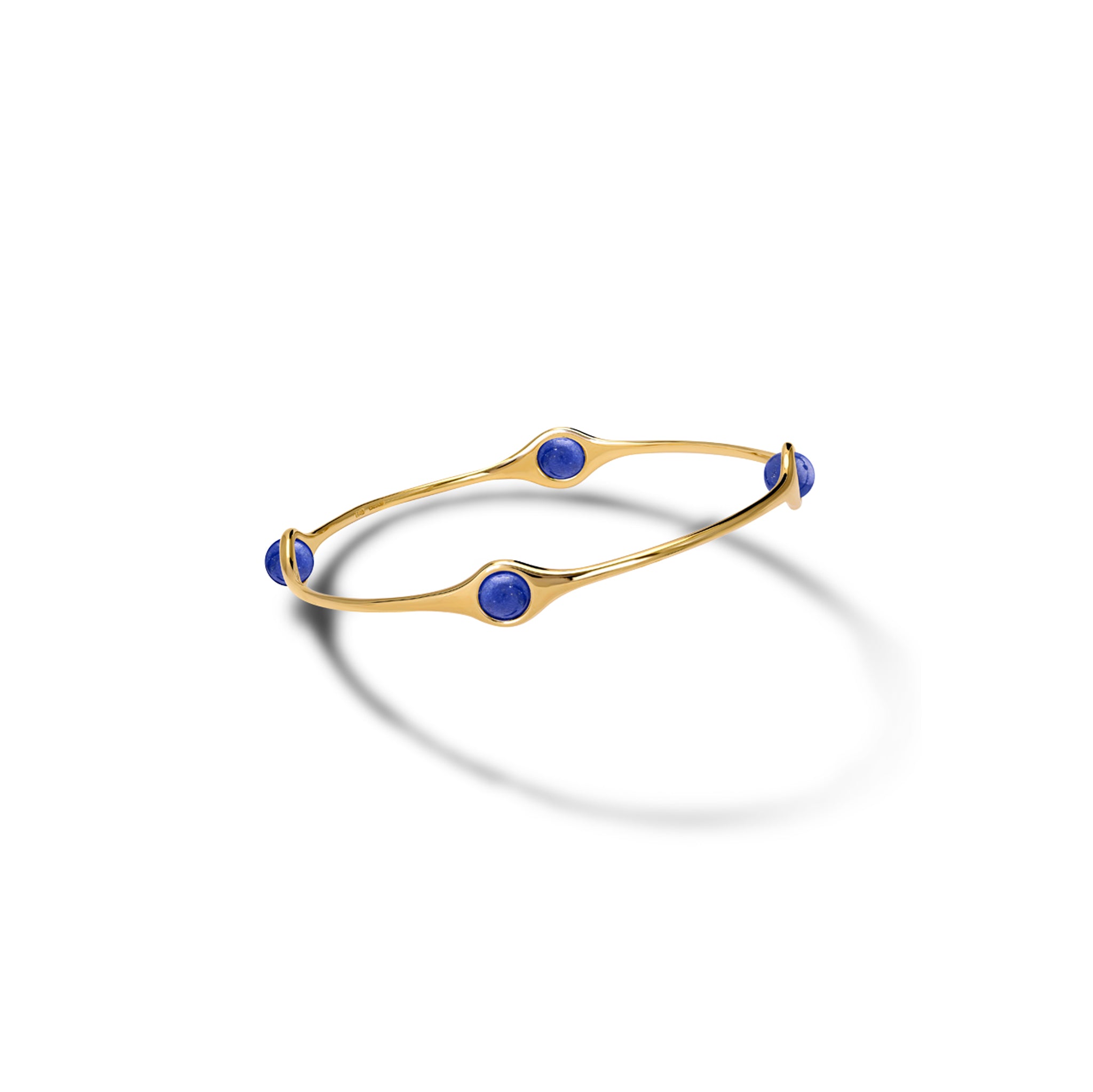 Handcrafted yellow gold bangle featuring four lapis lazuli beads.