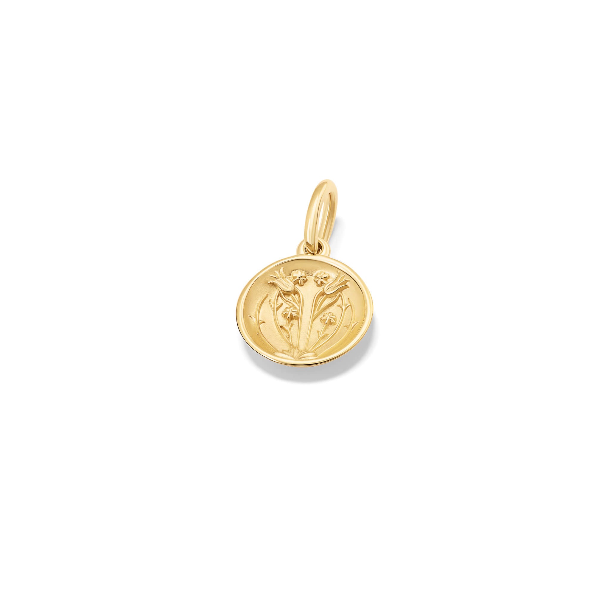 A handcrafted pendant with a tulip 'in relief'