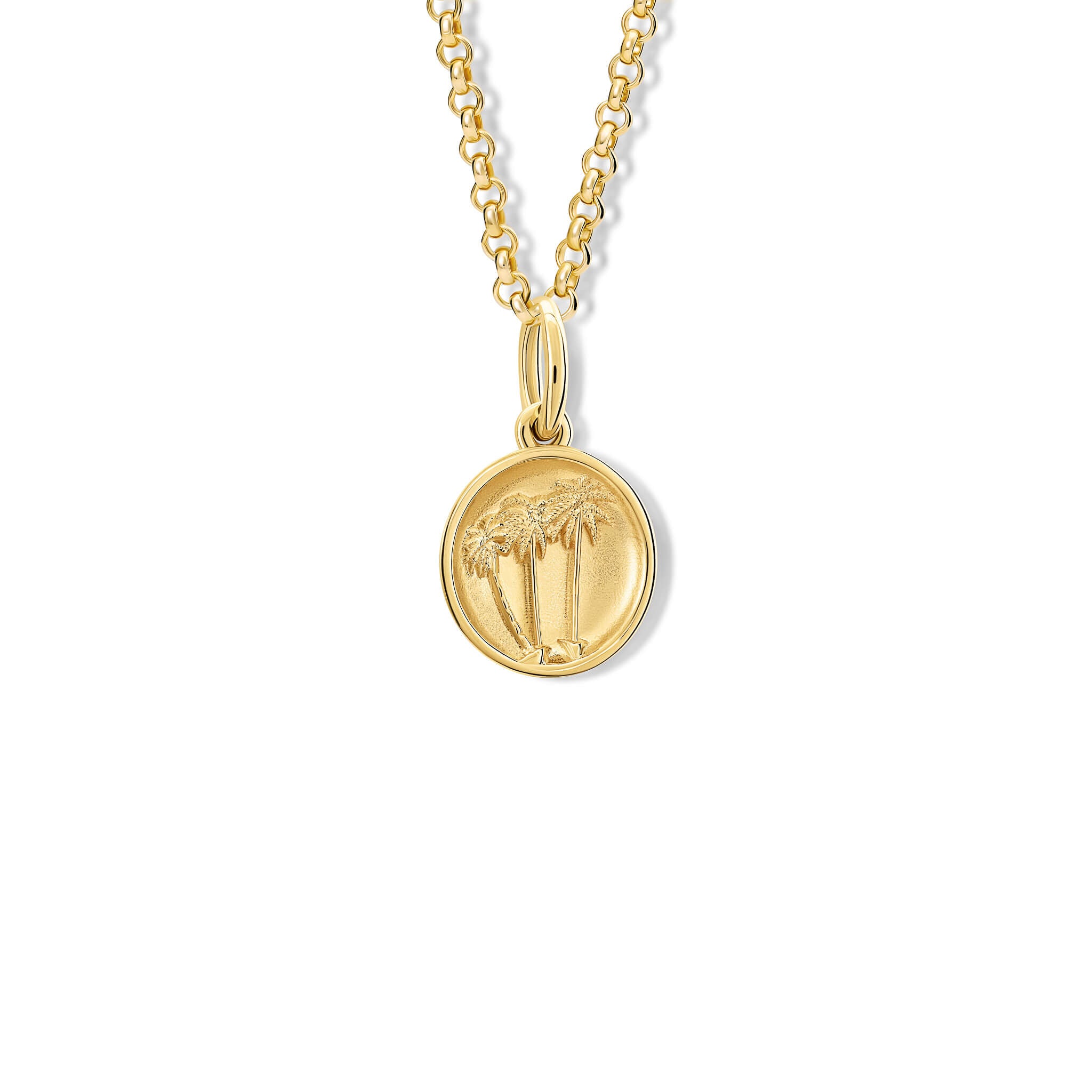 A handcrafted pendant with a palm trees 'in relief'