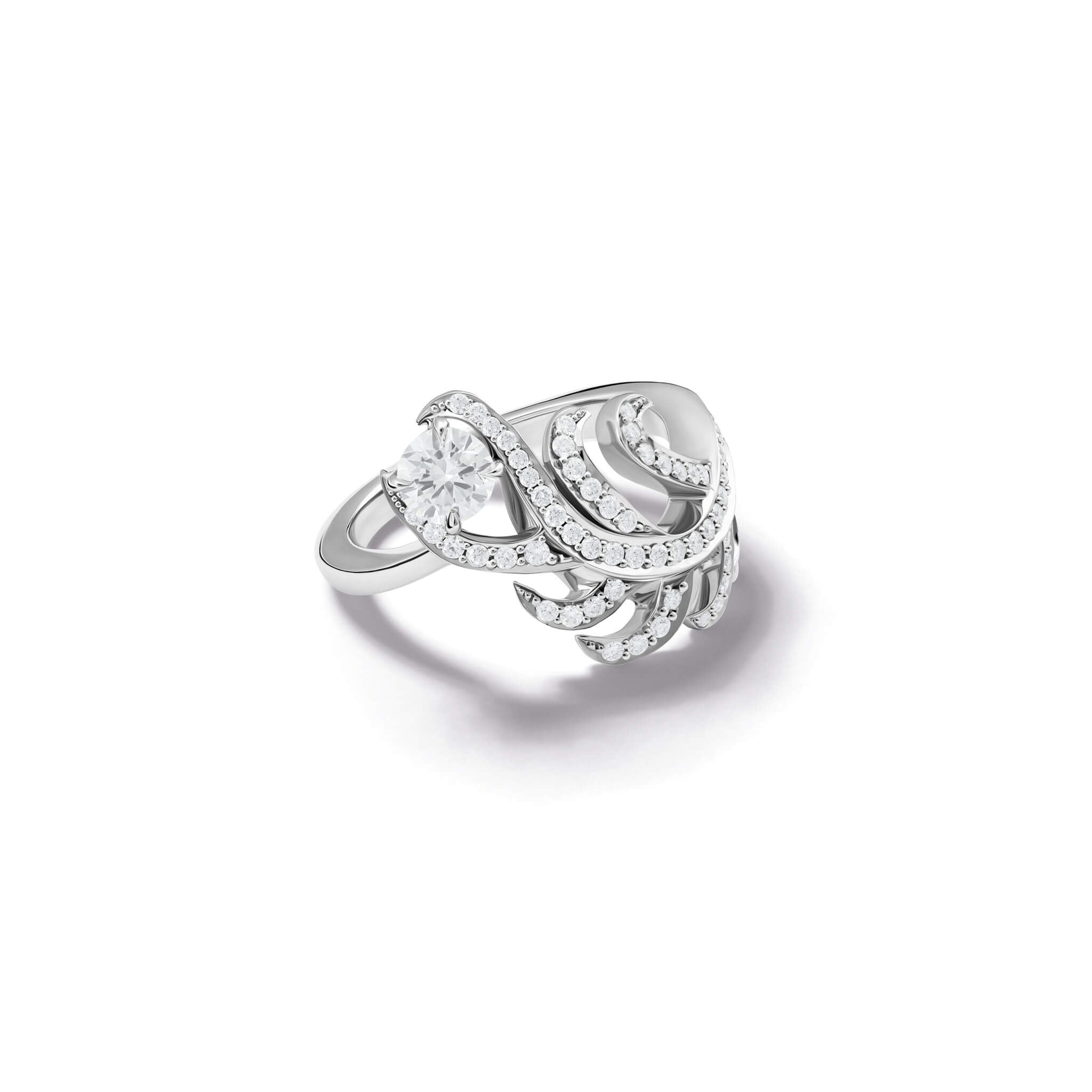 Handcrafted ring in the shape of a feather plume in 18ct white gold with diamond pavé and a central round diamond. 