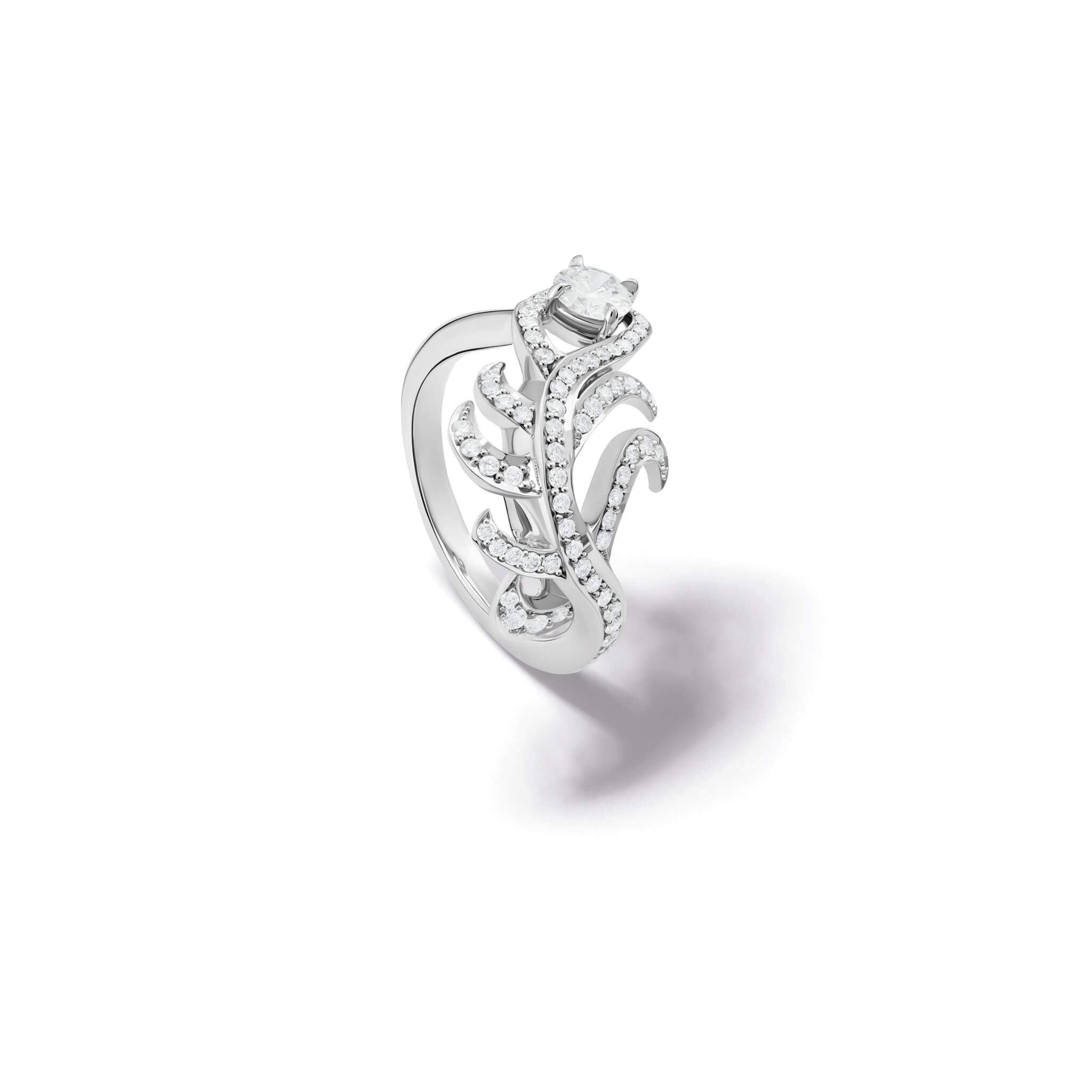 Handcrafted ring in the shape of a feather plume in 18ct white gold with diamond pavé and a central round diamond. 