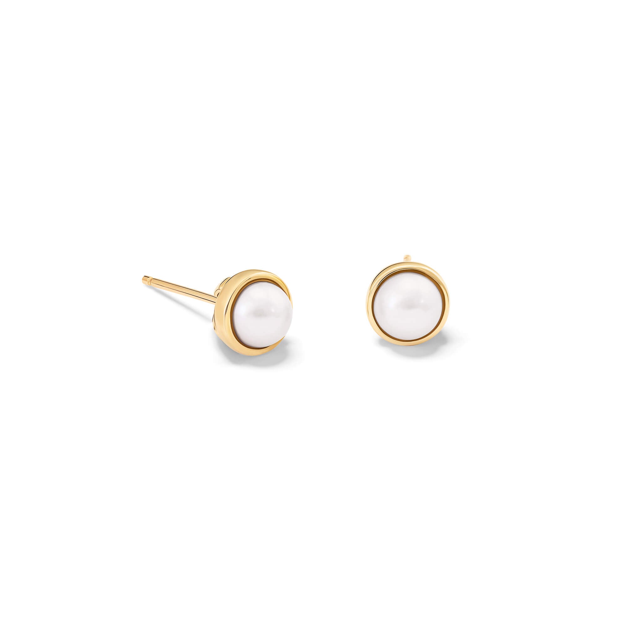 Handcrafted yellow gold stud earrings featuring round pearl, birthstone of June.