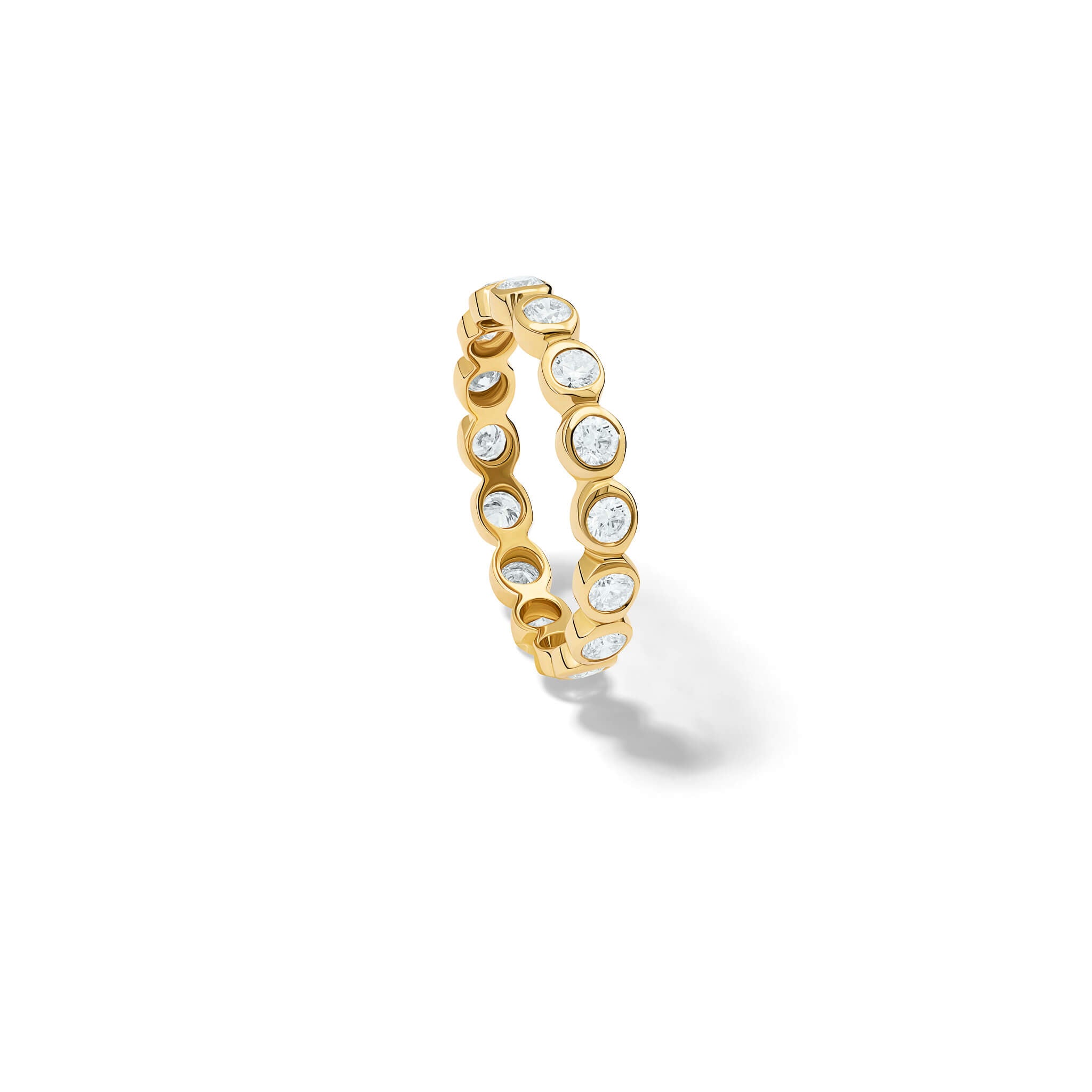 Handcrafted full eternity ring in 18ct yellow gold with rub over set round diamonds.