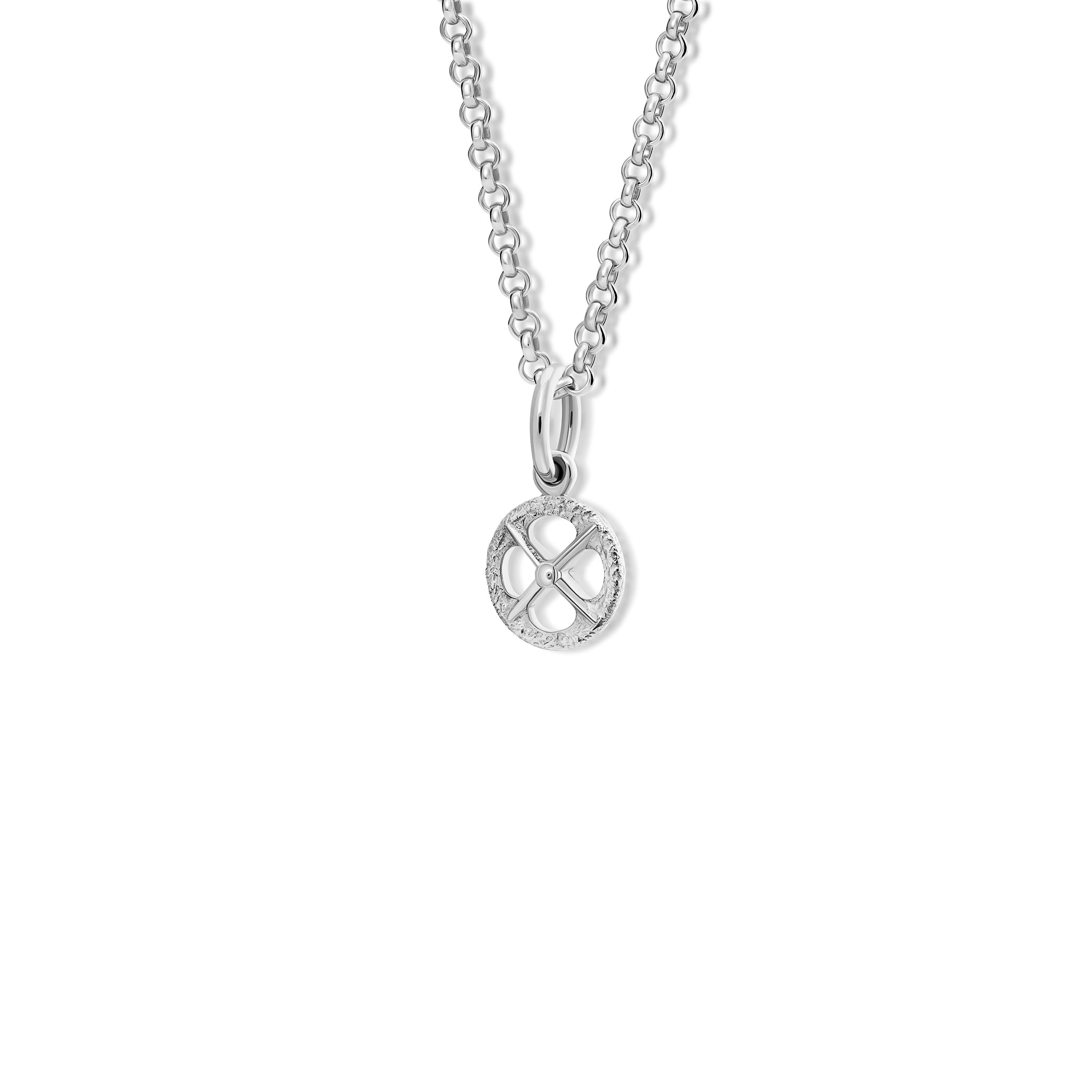 Handcrafted sterling silver necklace pendant with a circular motif and a cross in the middle.