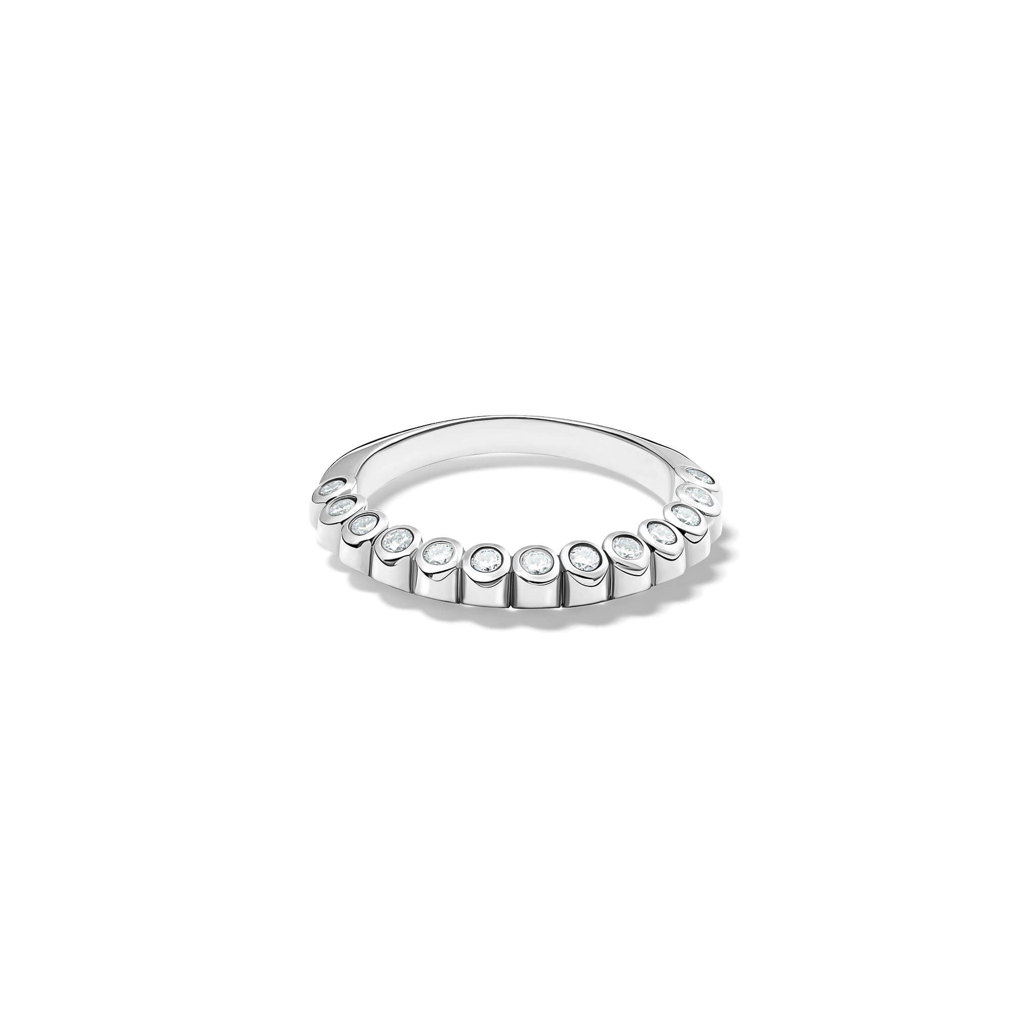 Handcrafted 18ct white gold eternity ring with diamonds on the side of the shank and smooth ridges along the top.