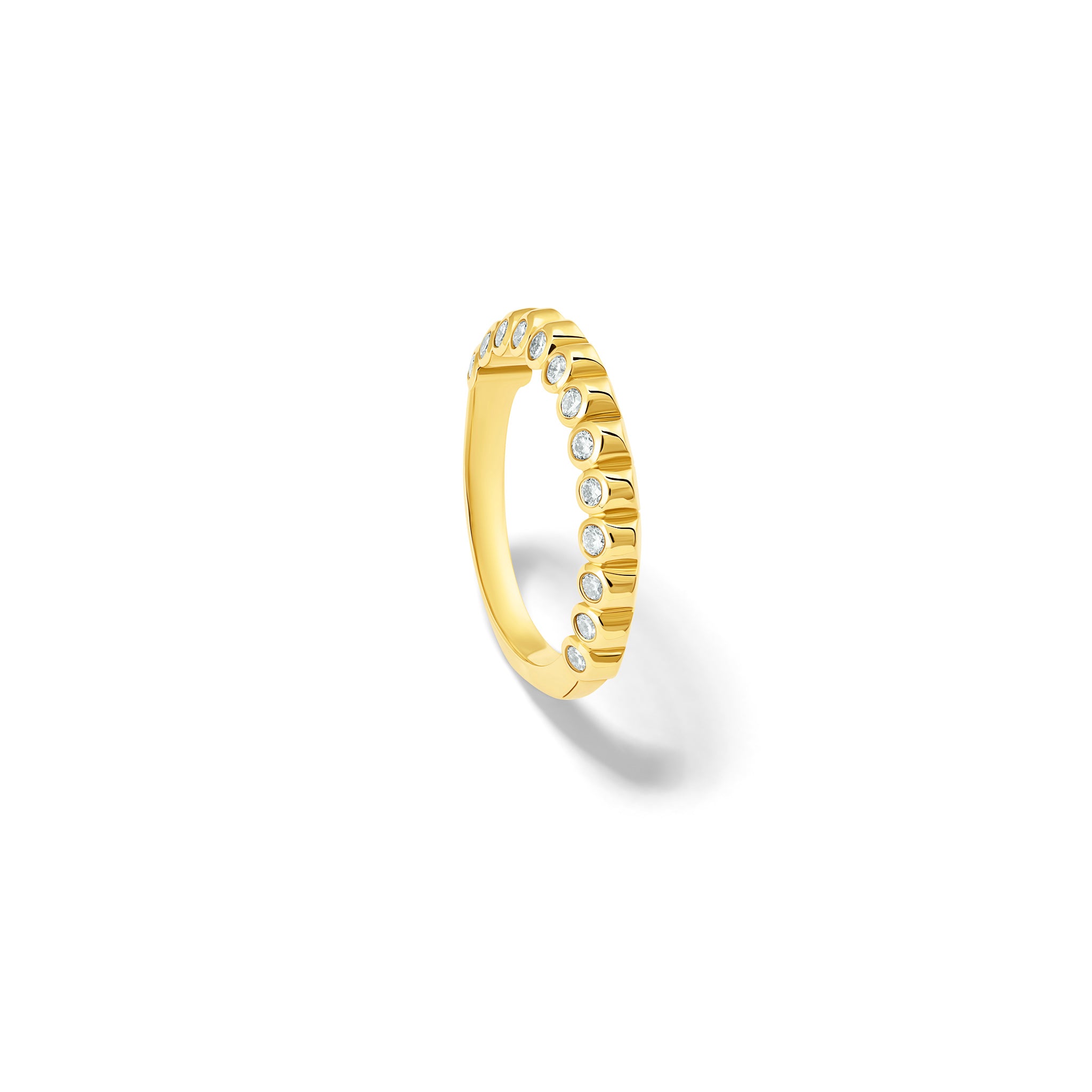 Handcrafted 18ct yellow gold eternity ring with diamonds on the side of the shank and smooth ridges along the top.