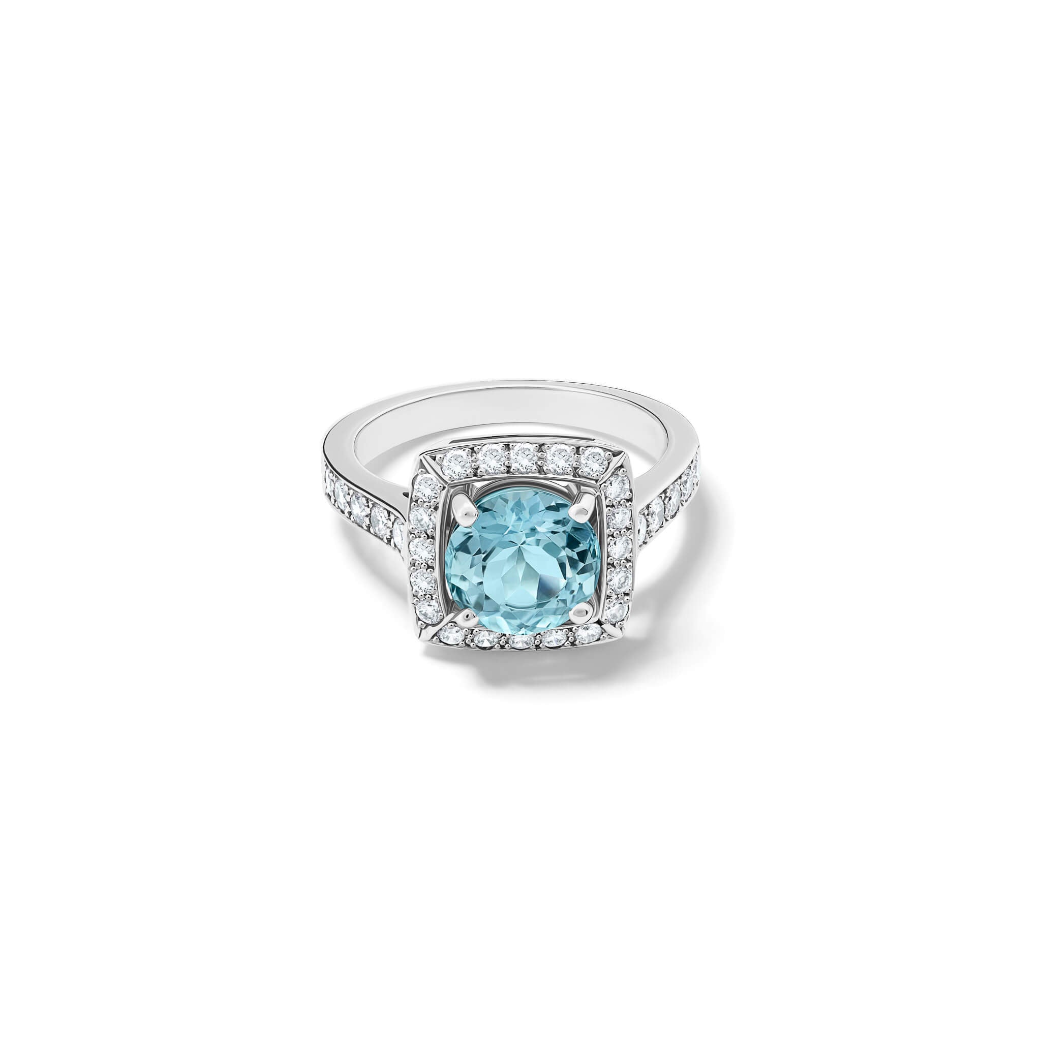Handcrafted engagement ring in 18ct white gold with a central round cut aquamarine surrounded by a square halo of pavé diamonds with a pavé diamond shank.