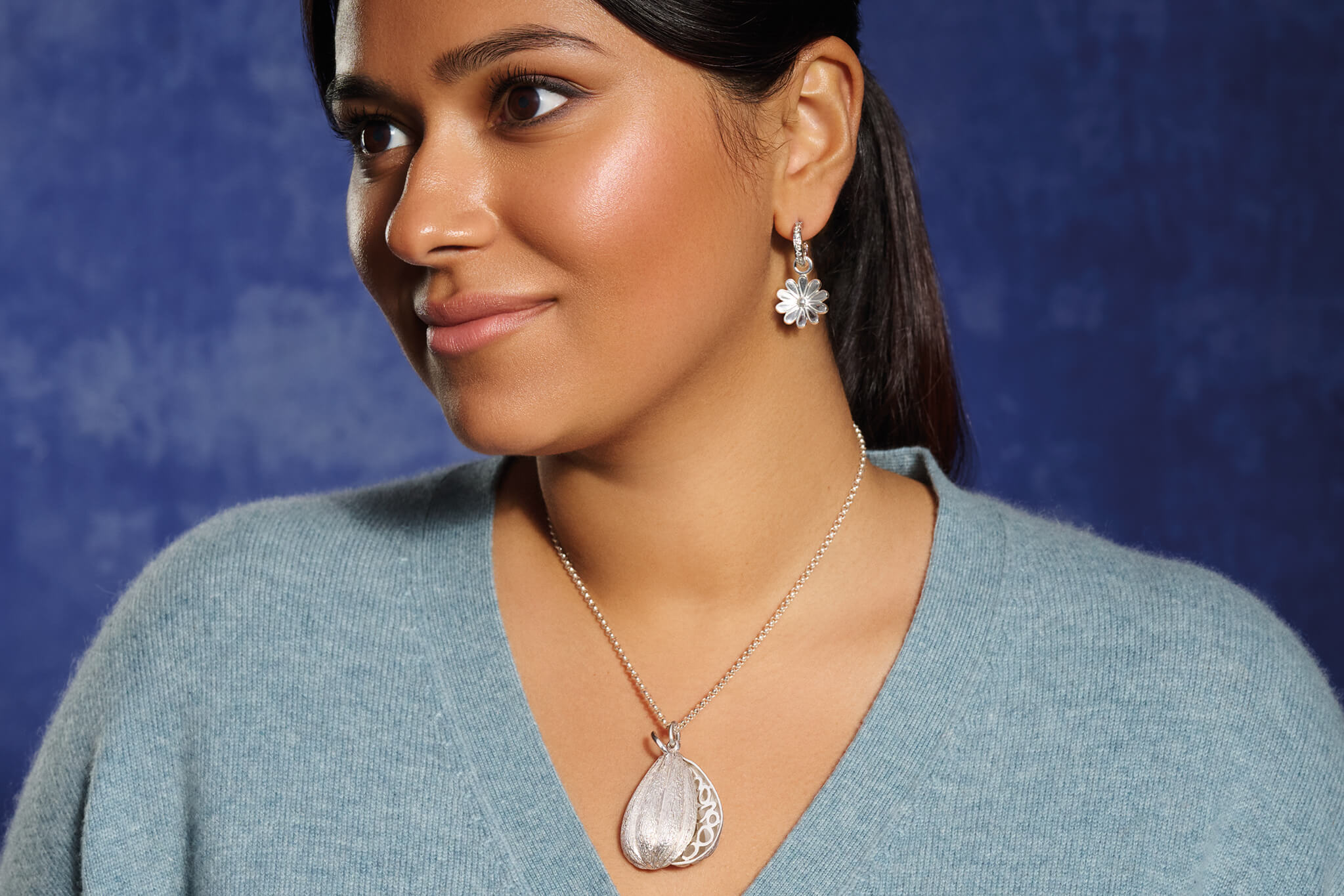 Model wearing handcrafted silver jewellery. 