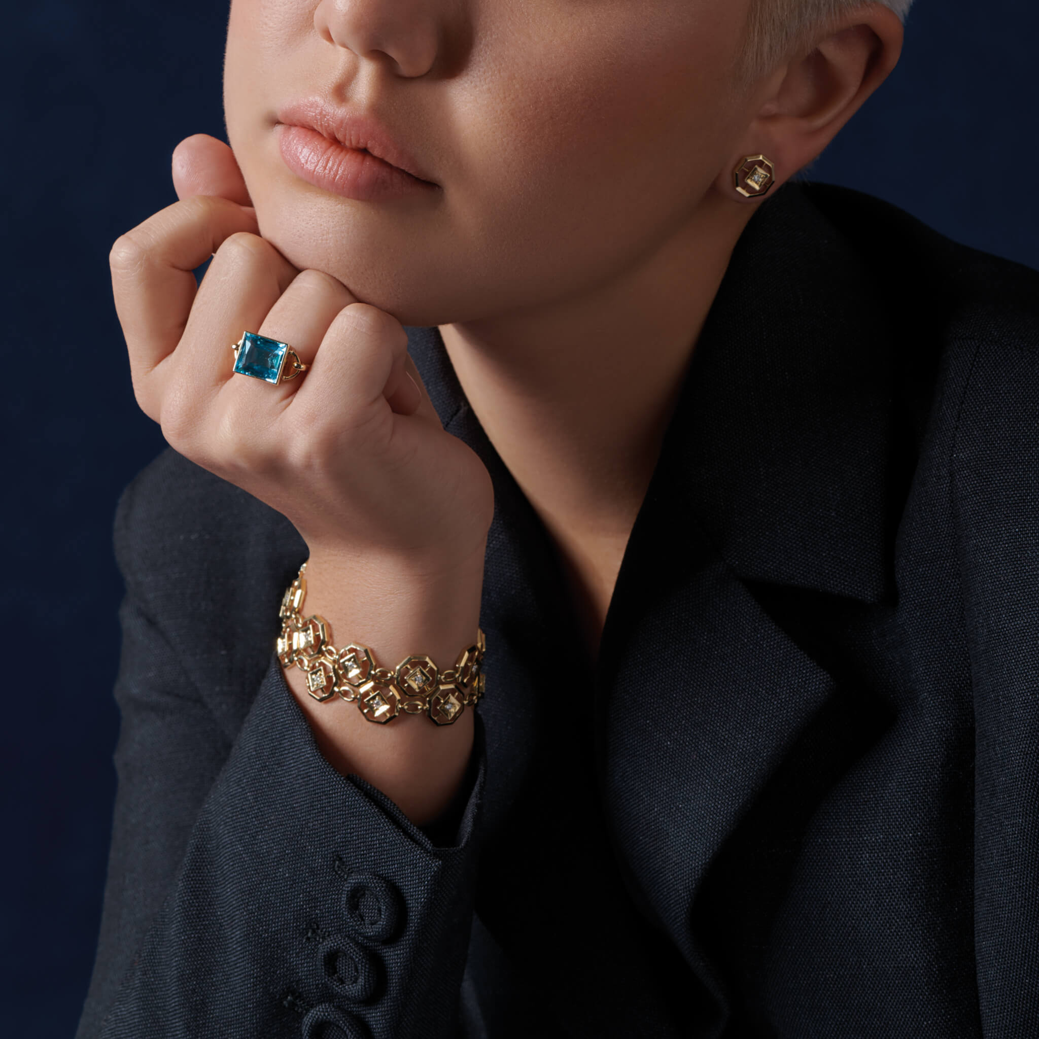 Model wears handcrafted bracelet in yellow gold with diamond parquet design from the Journey to France