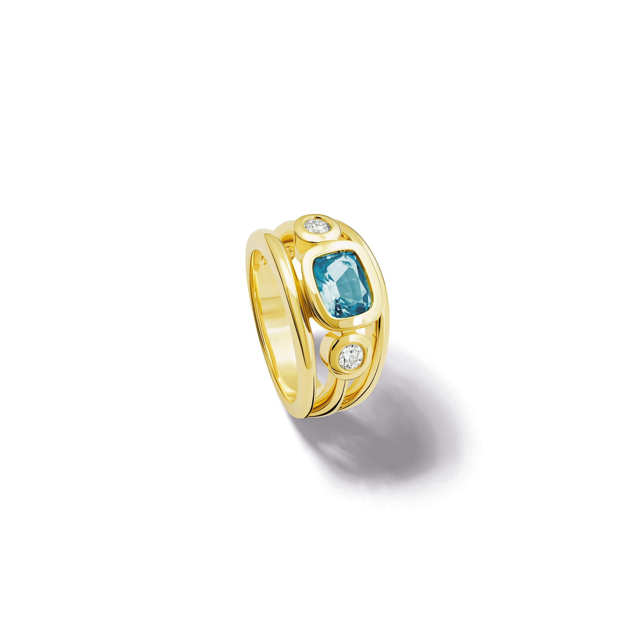 Handcrafted 18ct yellow gold ring with a central cushion cut aquamarine, the birthstone of March, flanked by two round diamonds.
