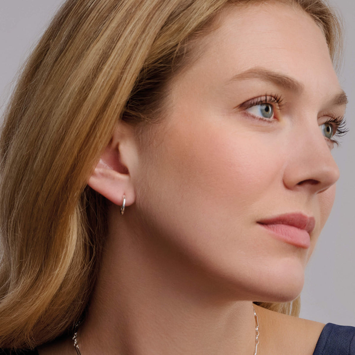 Handcrafted sterling silver and white gold hoop earring set.