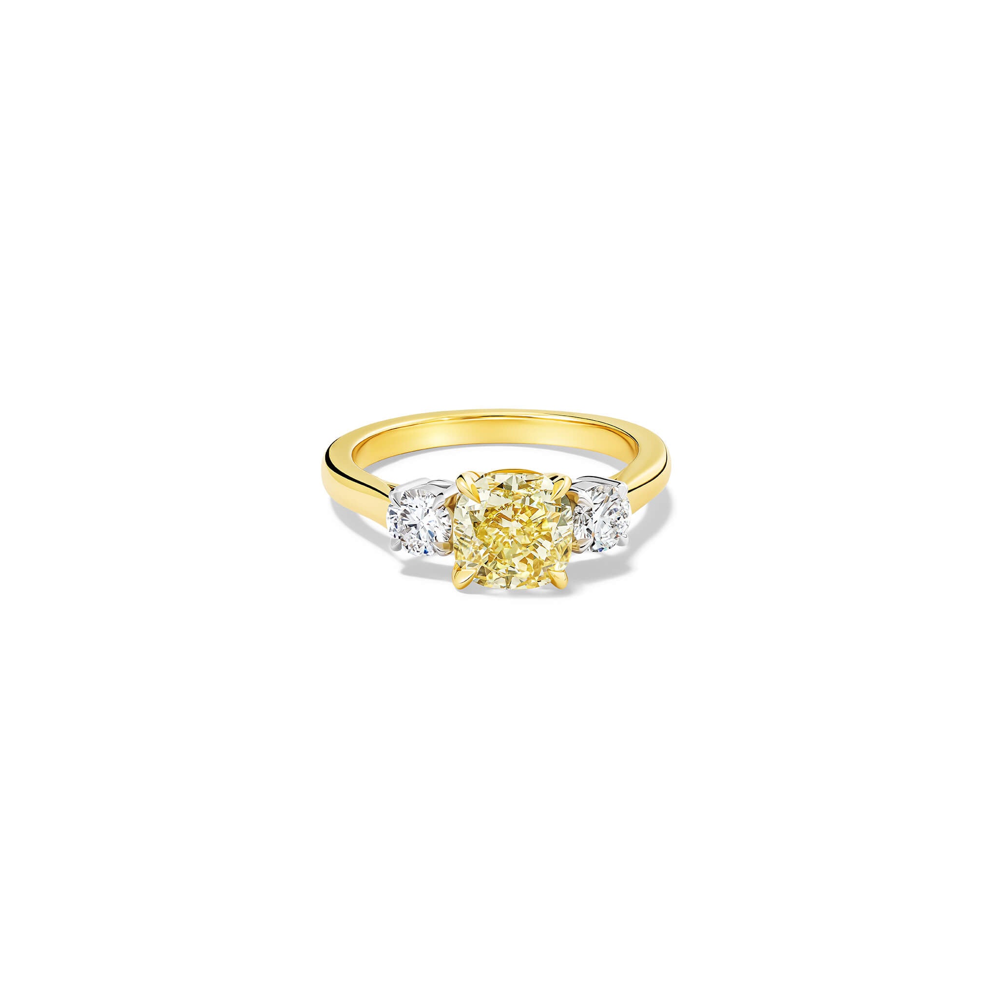 Handcrafted yellow gold yellow diamond engagement ring with two diamonds set in white gold on each side