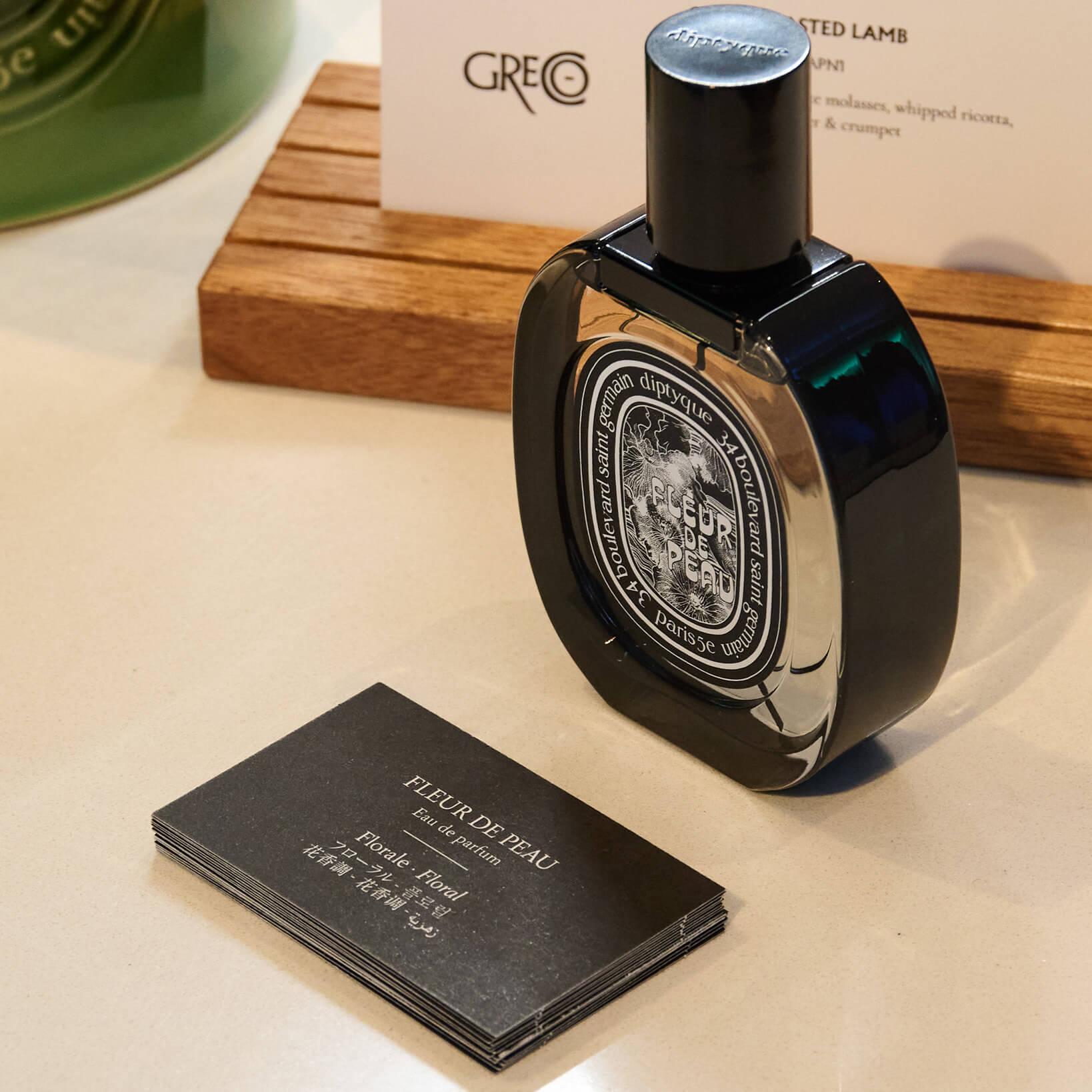 A bottle of Diptyque perfume Fleur de Peau