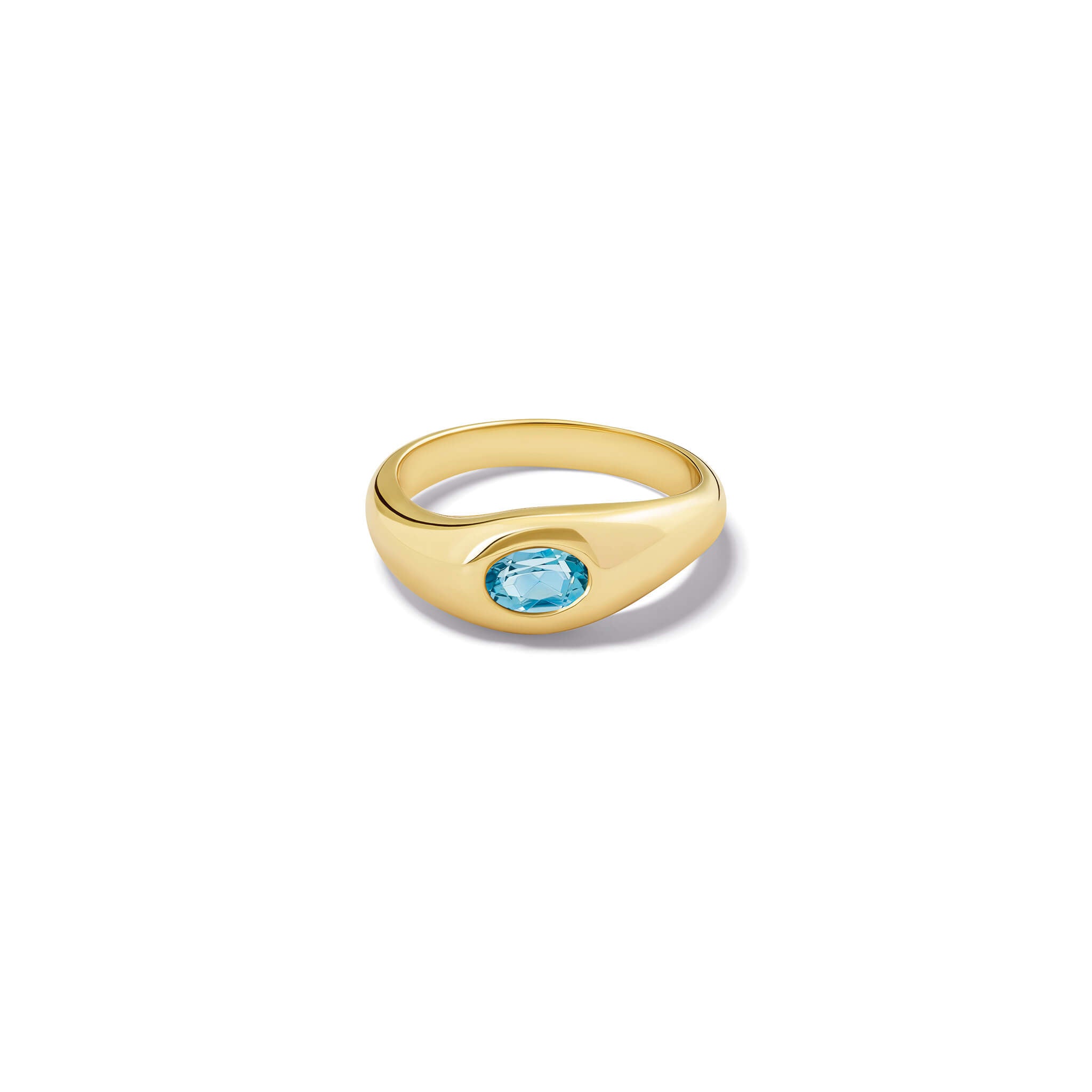 Handcrafted yellow gold ring with a slight teardrop design set with an oval facetted blue aquamarine, march birthstone