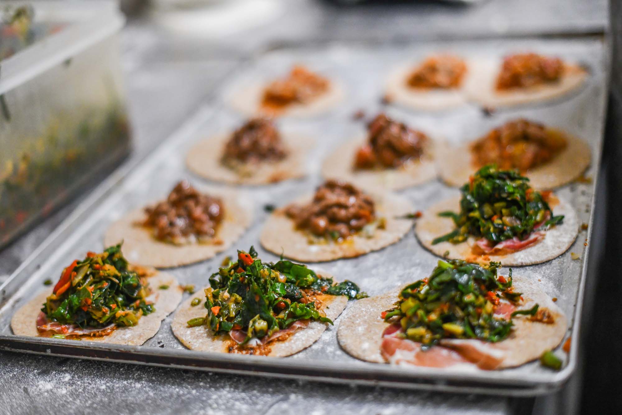 Feyrouz restaurant, a tray of small pastries behind the scenes in the kitchen. 