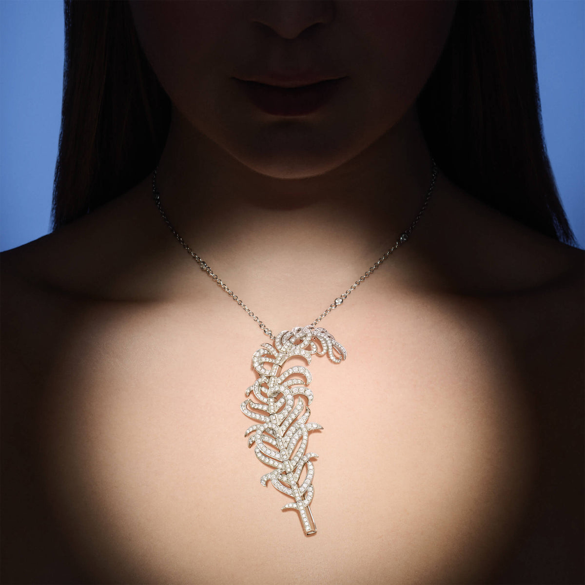 Model wearing handcrafted high jewellery Feather Plume in white gold with diamonds, inspired by a plumage