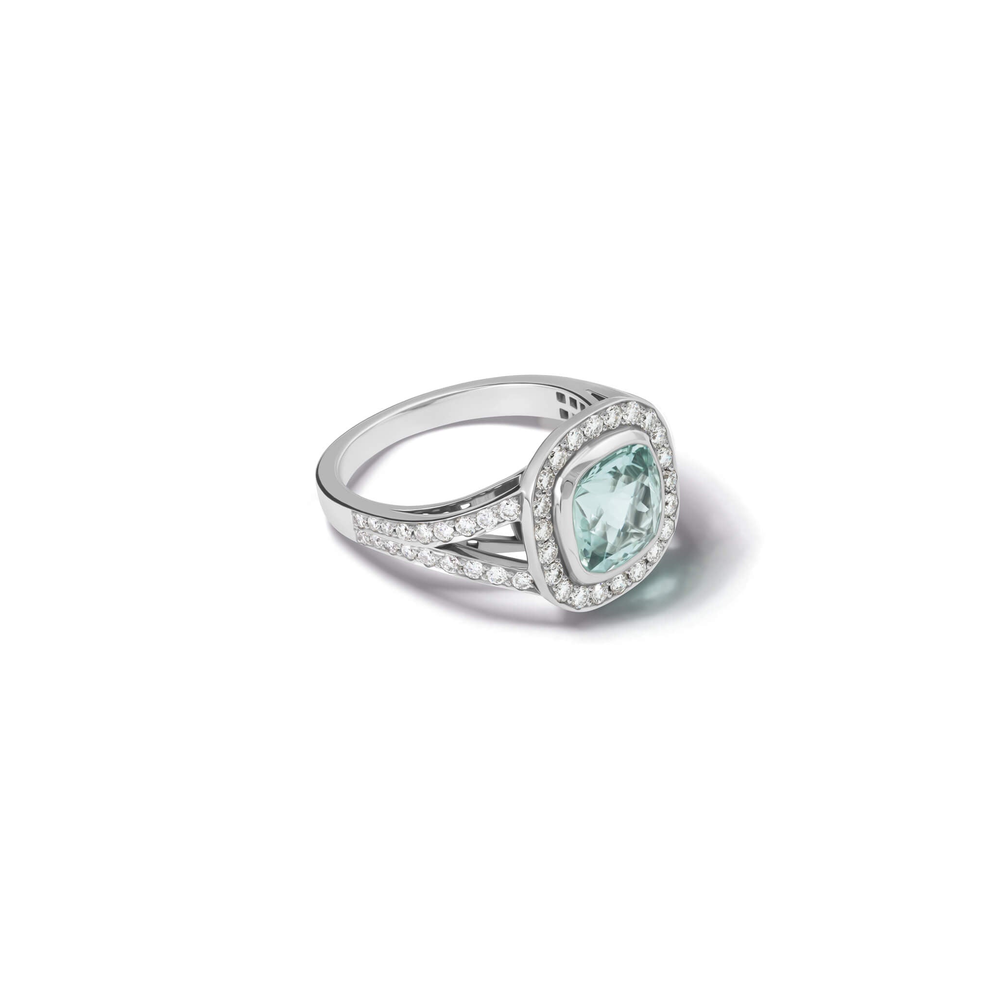 Handcrafted 18ct white gold engagement ring featuring a rub over set cushion-cut aquamarine surrounded by a halo of small diamonds and smaller diamonds embedded along the band.